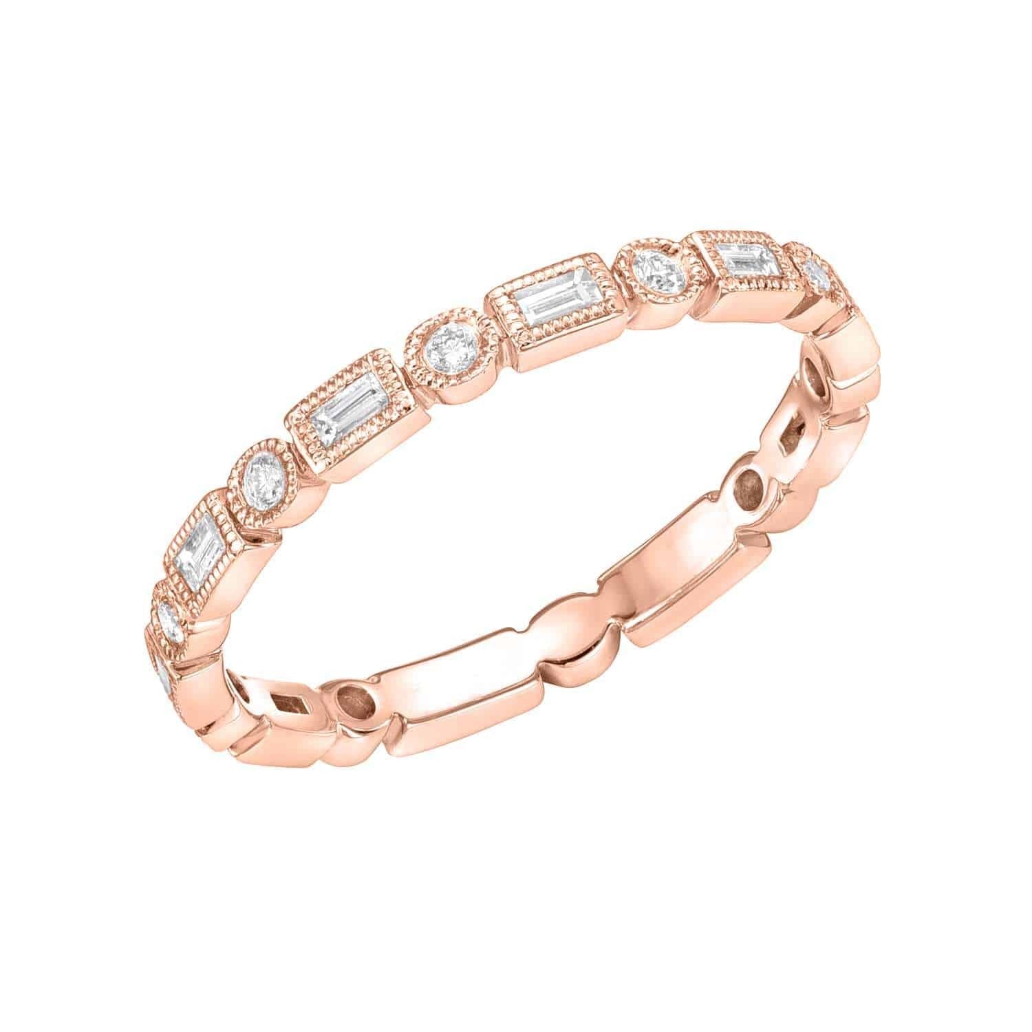 Introducing the Diamond Shapes Ring by Janet Heller—a rose gold ring showcasing a striking combination of alternating round and rectangular diamonds in refined bezel settings. Available as a preorder, this elegant jewelry piece offers timeless sophistication with its modern design.