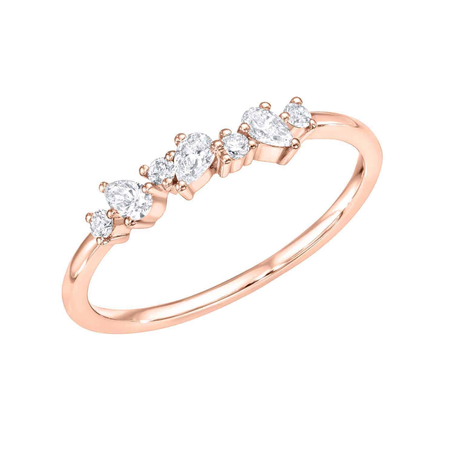 Explore the elegant Mixed Cut Diamond Ring: a delicate rose gold band featuring five small, round white gemstones set in a graceful curve. Evenly spaced for a refined look, this polished piece exudes sophistication. Preorder now.