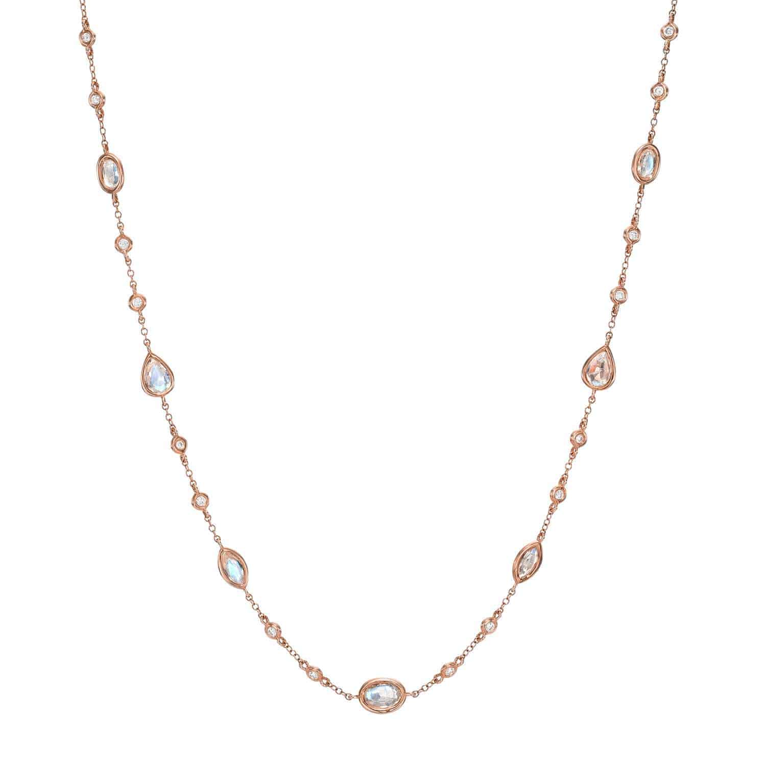 The Morganite & Diamond Necklace by Janet Heller Fine Jewelry is crafted in 14KT gold. The delicate necklace features evenly spaced oval and teardrop stones along the chain. The necklace can be worn alone or layered with other chains.
