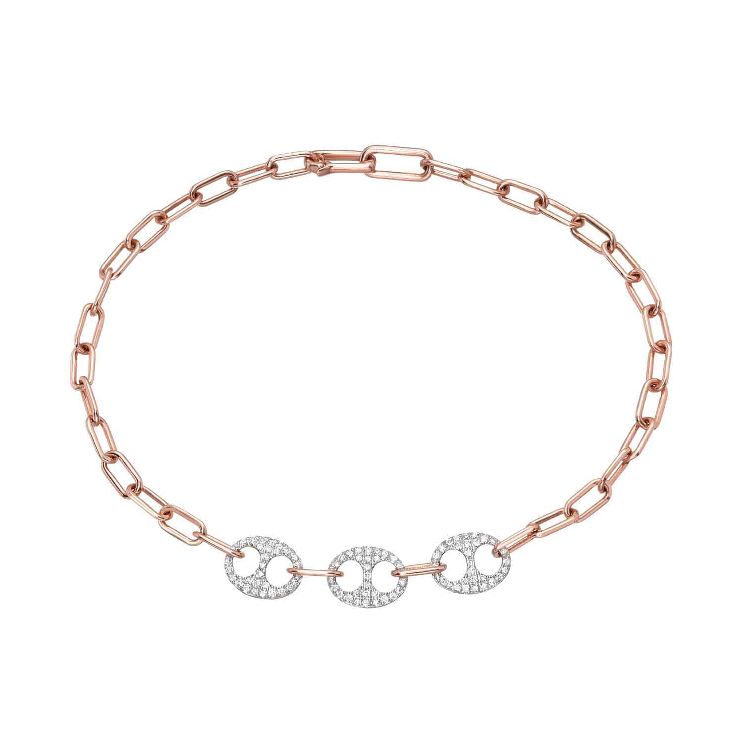 The Two Tone Diamond Link Bracelet from Janet Heller Fine Jewelry is crafted in 14KT gold. The bracelet features three interlocking circular links embellished with diamonds. The bracelet can be worn on its own or stacked wit other bracelets.
