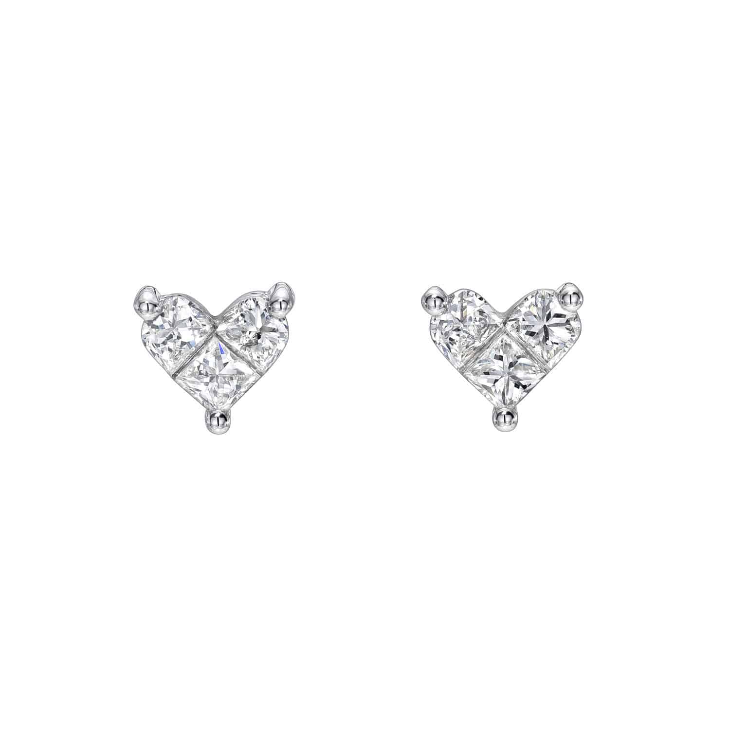 The Diamond Heart Clementine Studs from Janet Heller Fine Jewelry feature sparkling stones set symmetrically, capturing light for brilliance on their silver-tone setting. Customization options are available, and the earrings are elegantly presented against a white background.
