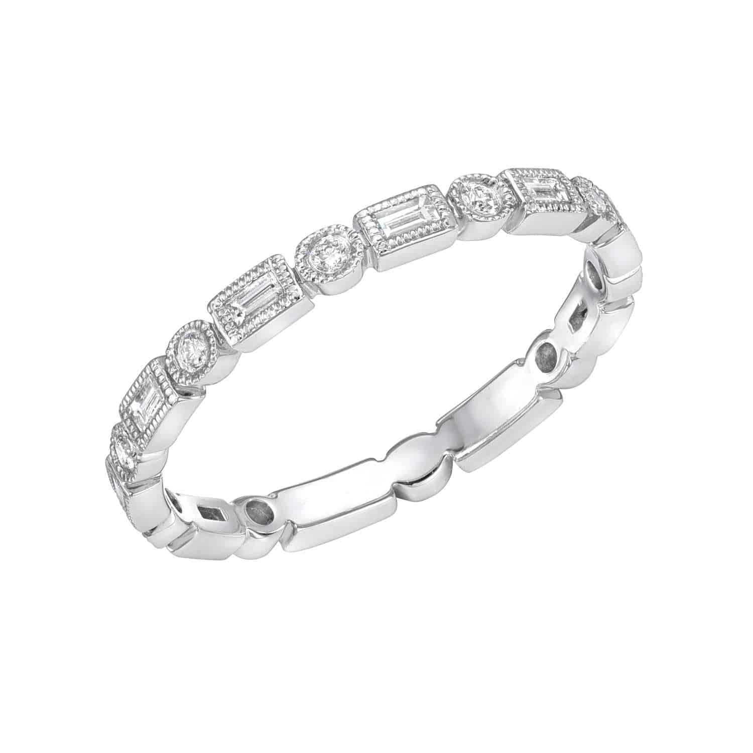 The Diamond Shapes Ring is a white gold piece with alternating round and rectangular diamond settings, showcasing a delicate, vintage-inspired design. Available as a preorder ring, this exquisite creation exemplifies Janet Heller’s artistry in fine jewelry—perfect for those seeking timeless elegance.