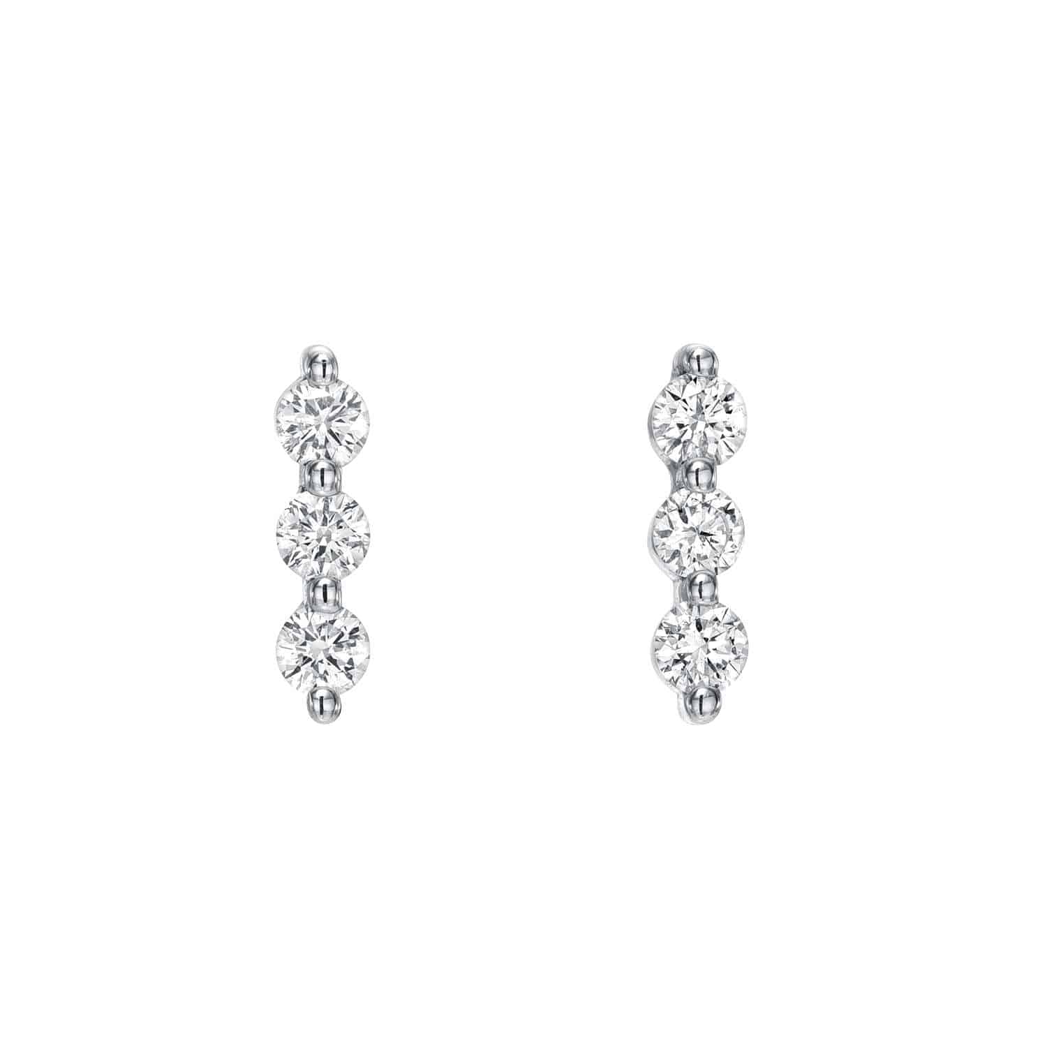 The Diamond Trio Bar Studs from Janet Heller Fine Jewelry showcase three round, sparkling diamonds set vertically in a minimalist silver design. Their evenly spaced gems offer an elegant touch on a plain white background, ideal for personalization with customizations.