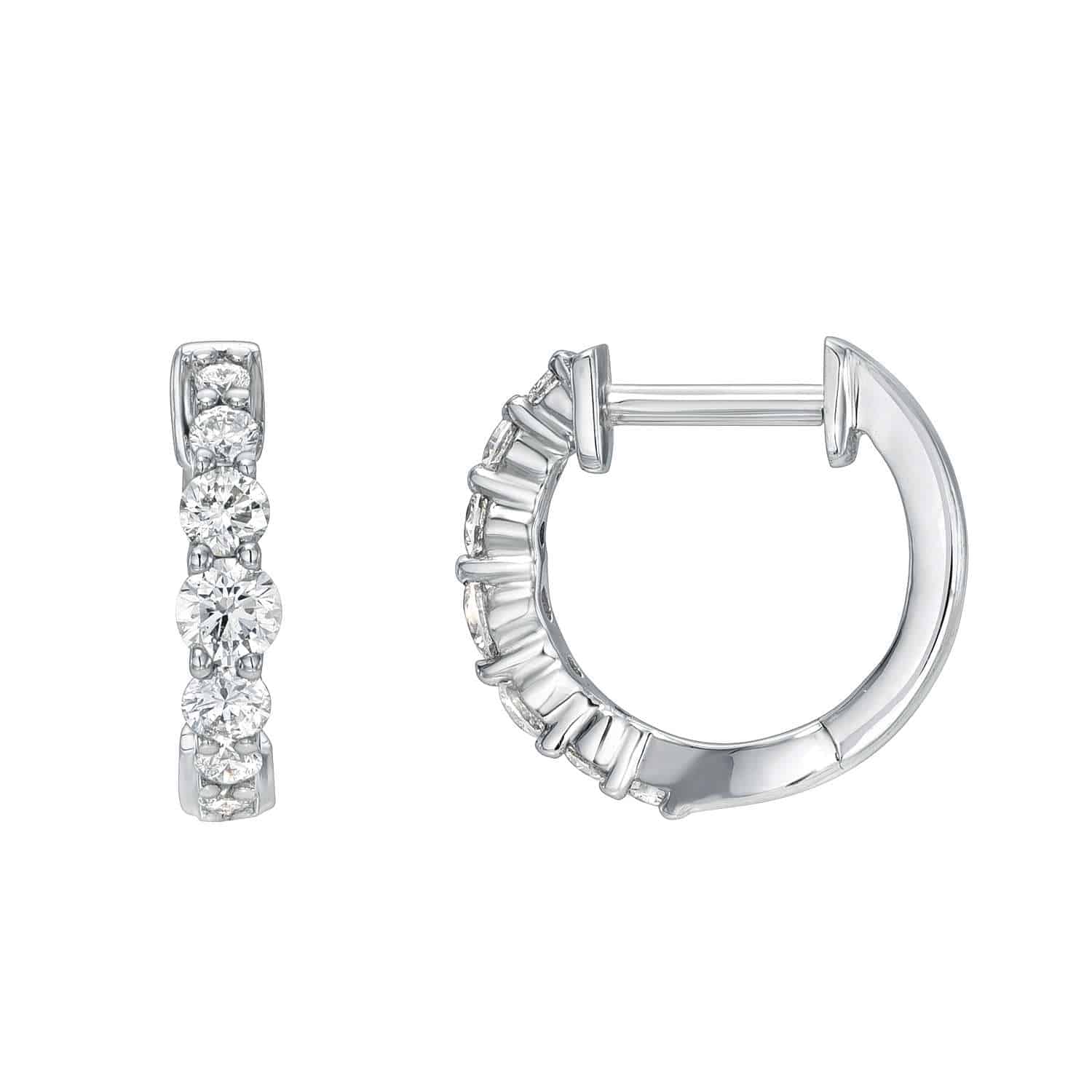 A pair of Graduating Diamond Huggies, each featuring five round clear gemstones. One earring displays the stones front-on, while the other highlights the clasp. Contact us for customizations or more information about this exquisite jewelry piece.