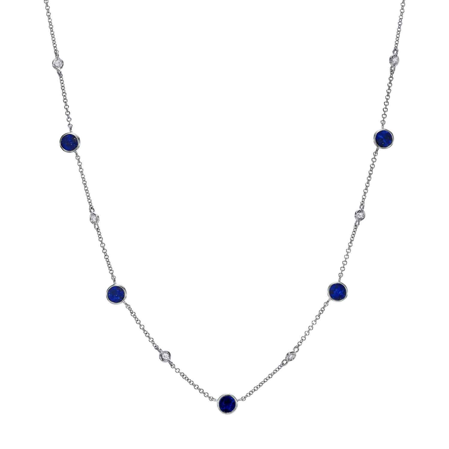 The Lapis Piper Necklace from Janet Heller Fine Jewelry is crafted in 14KT gold. The delicate chain features alternating lapis and diamond stones. The necklace can be worn alone or layered with other chains.