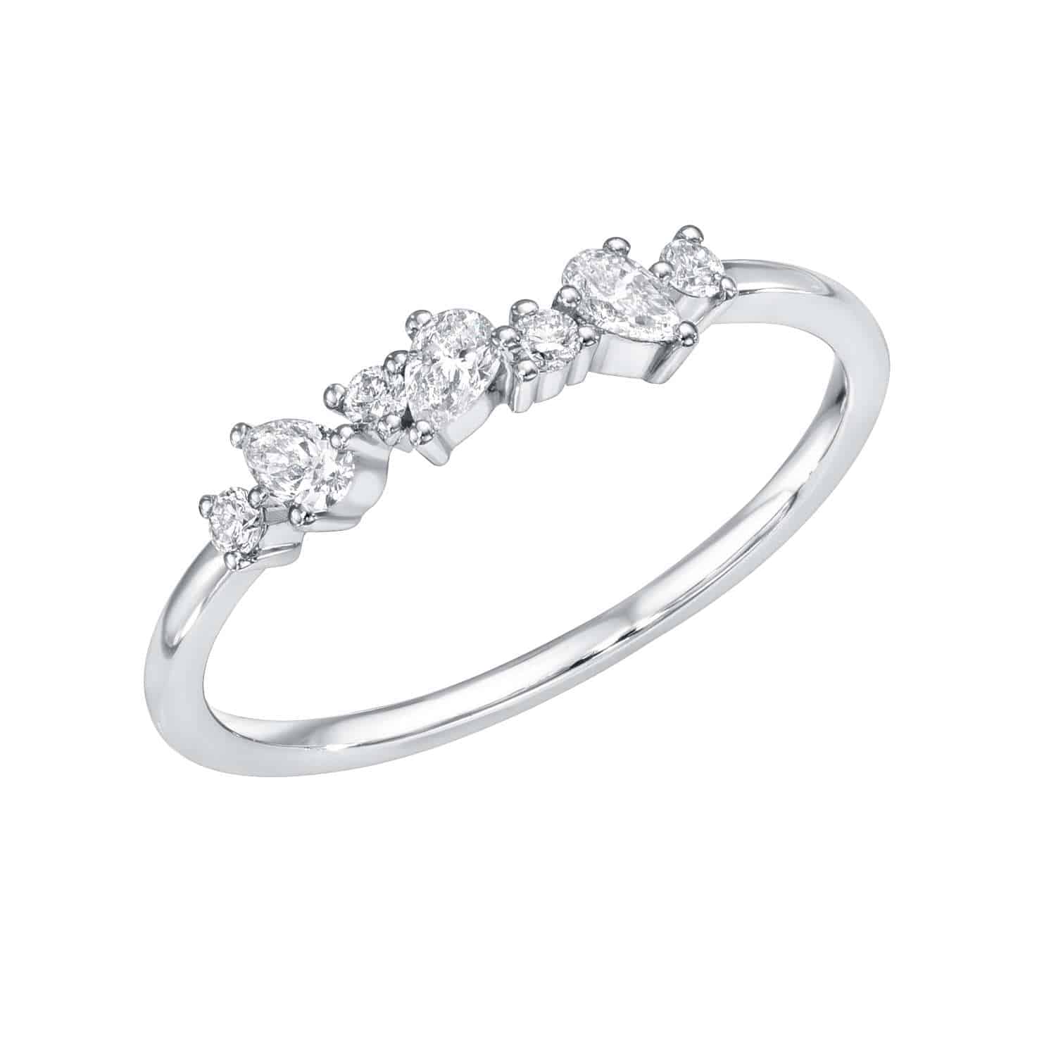 The Mixed Cut Diamond Ring features a delicate silver band with five round diamonds in a graduated sequence. Its elevated prong setting enhances its classic, elegant design, making it perfect for lovers of timeless beauty. Available for preorder now.