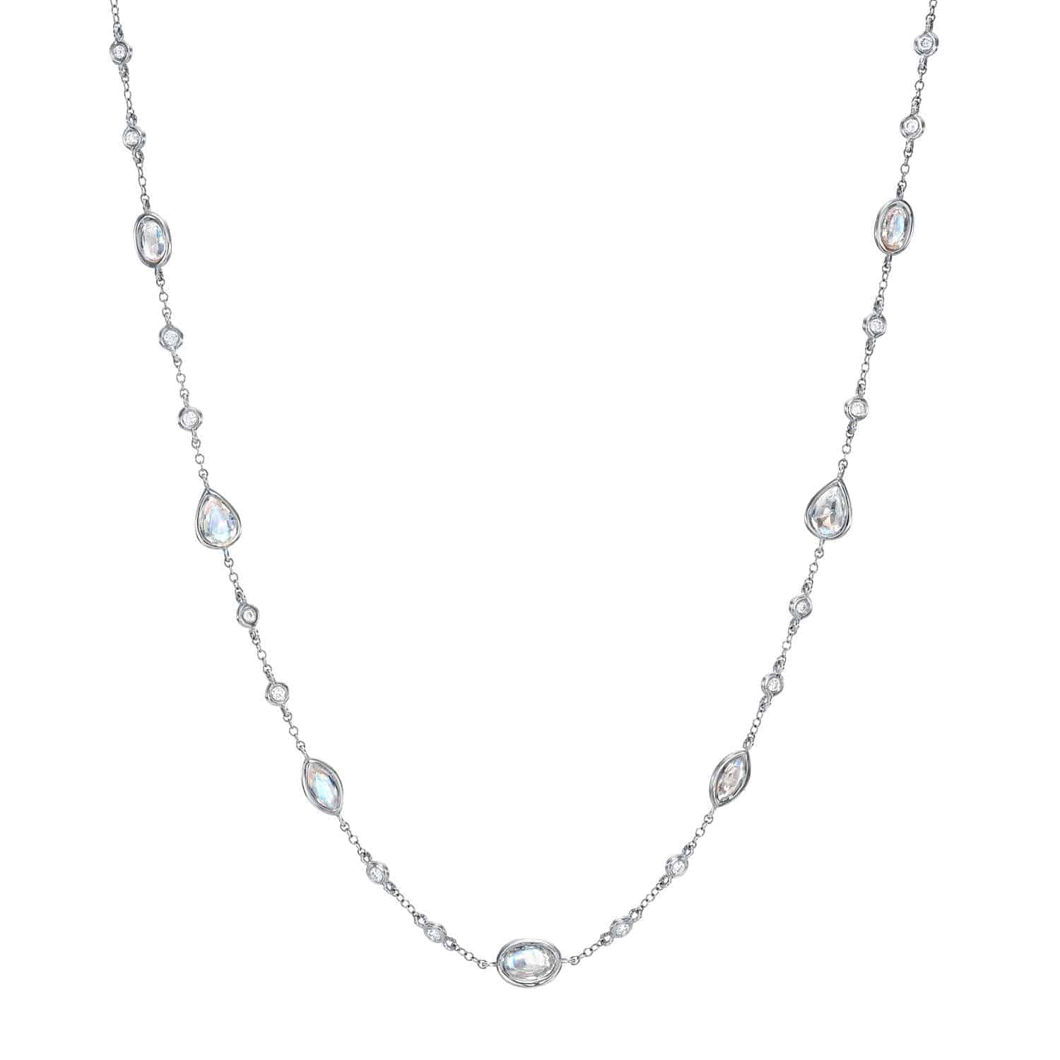 The Morganite & Diamond Necklace by Janet Heller Fine Jewelry is crafted in 14KT gold. The delicate necklace features evenly spaced oval and teardrop stones along the chain. The necklace can be worn alone or layered with other chains.