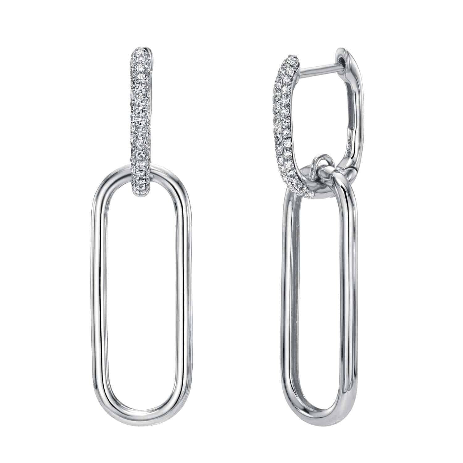 A pair of Diamond Jordan Earrings by Janet Heller Fine Jewelry features oval-shaped silver links—each earring’s upper section adorned with small, sparkling stones, and the lower link smooth and plain—a timeless testament to Janet Heller’s exquisite jewelry craftsmanship.