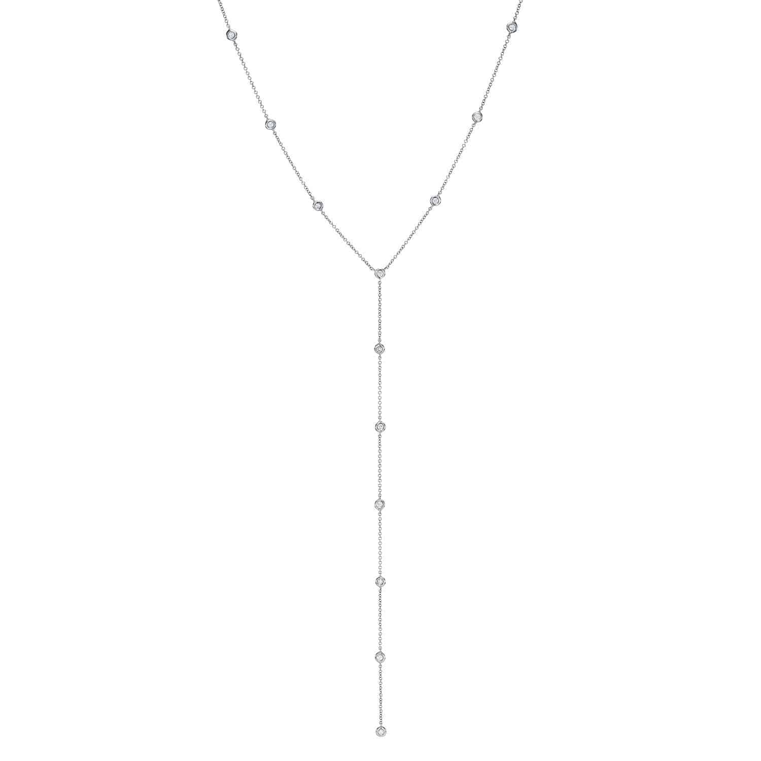The Diamond Sofia Lariat from janethellerfinejewelry is a delicate silver necklace with small round gems evenly spaced and a minimalist design featuring a strand ending in a gem-encrusted tip. Contact for customizations or inquiries.