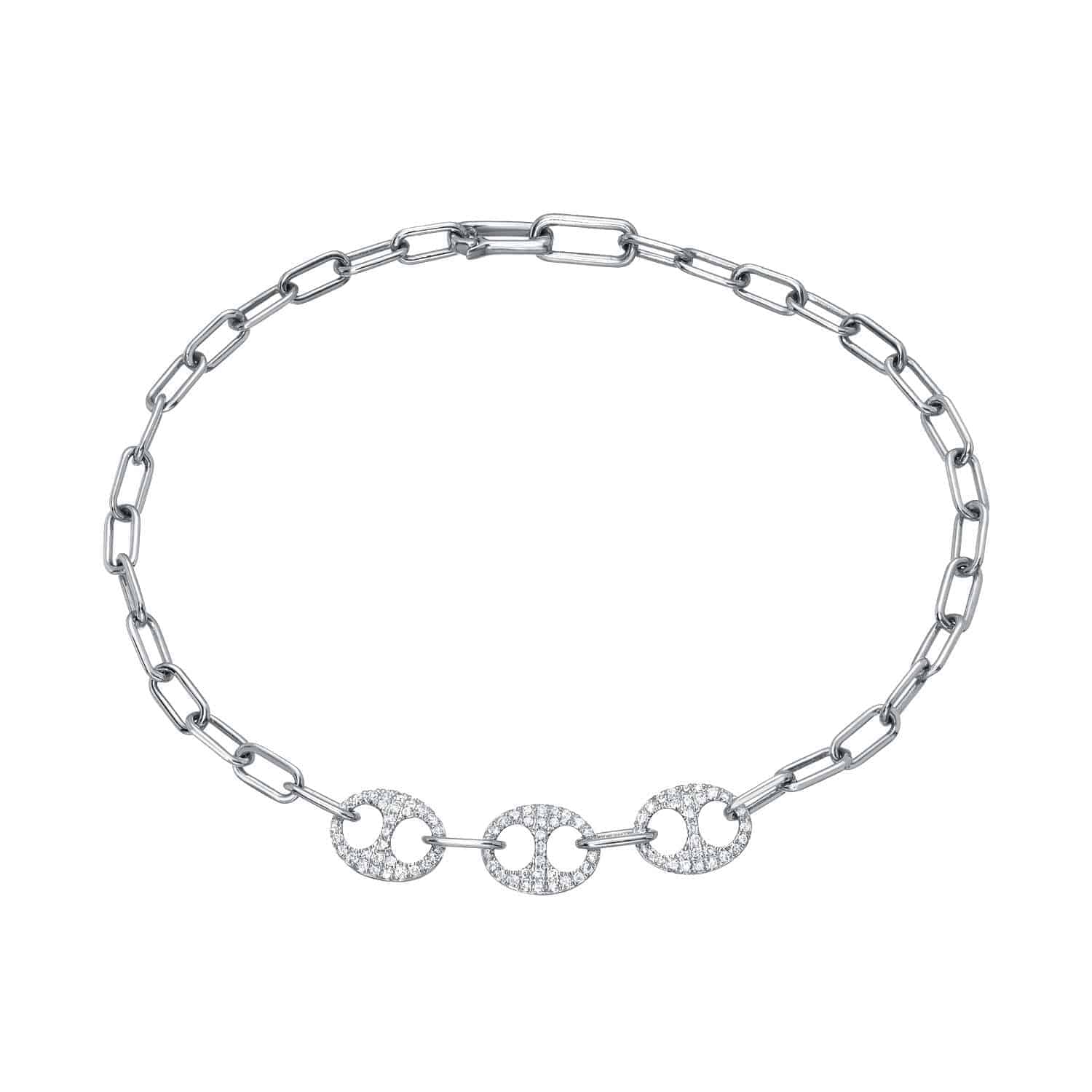The Two Tone Diamond Link Bracelet from Janet Heller Fine Jewelry is crafted in 14KT gold.  The bracelet features  three interlocking circular links embellished with diamonds.  The bracelet can be worn on its own or stacked wit other bracelets.