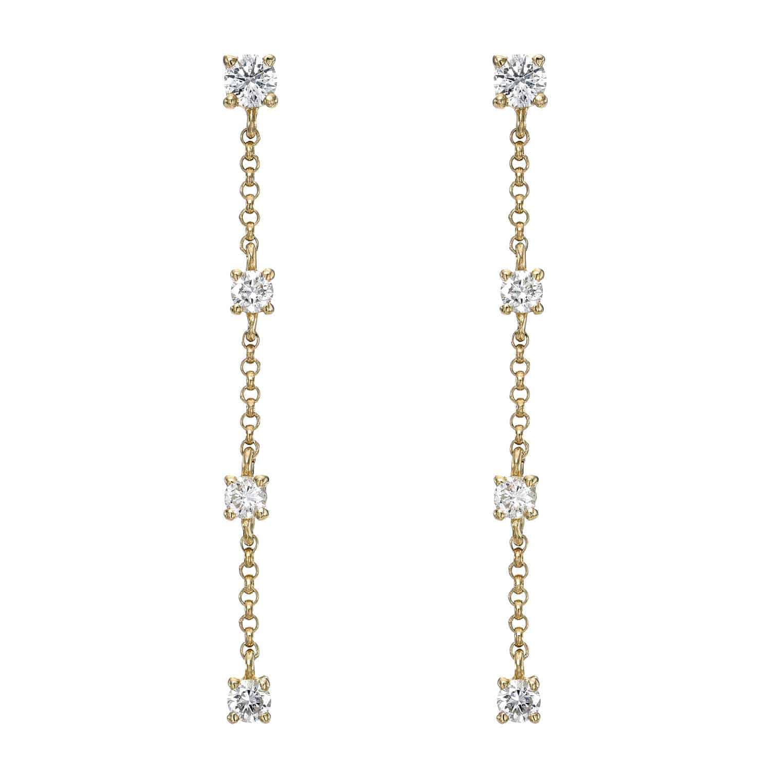 The 4 Drop Diamond Finley Earrings by Janet Heller Fine Jewelry are crafted in 14KT gold. The dangling earrings feature four evenly spaced round diamonds connected by a delicate chain. The earrings can be worn alone or layered along the ear with other earrings.
