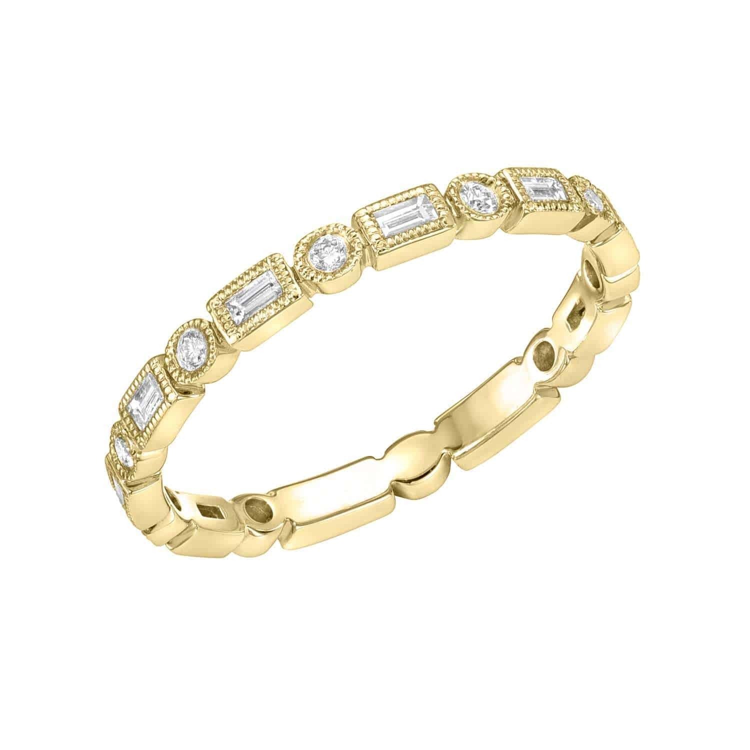 The Diamond Shapes Ring from Janet Heller's fine jewelry collection is crafted in yellow gold and showcases alternating round and rectangular diamonds set in a repeating pattern around the band. This elegant piece is available for preorder.