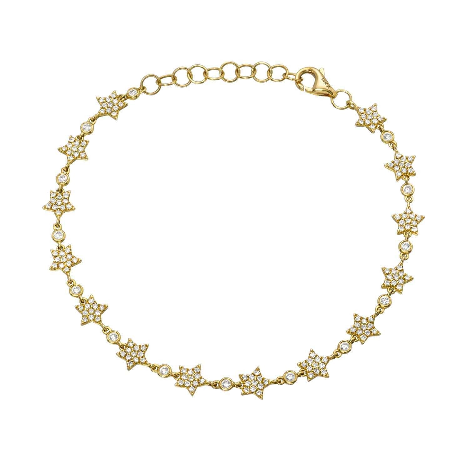 Introducing the Repeating Diamond Stars Bracelet: a gold bracelet featuring small, star-shaped links encrusted with clear stones and connected by delicate round links, complete with an adjustable clasp. This stunning piece from Janet Heller Fine Jewelry is perfect for those seeking elegant custom jewelry or looking to make jewelry inquiries.