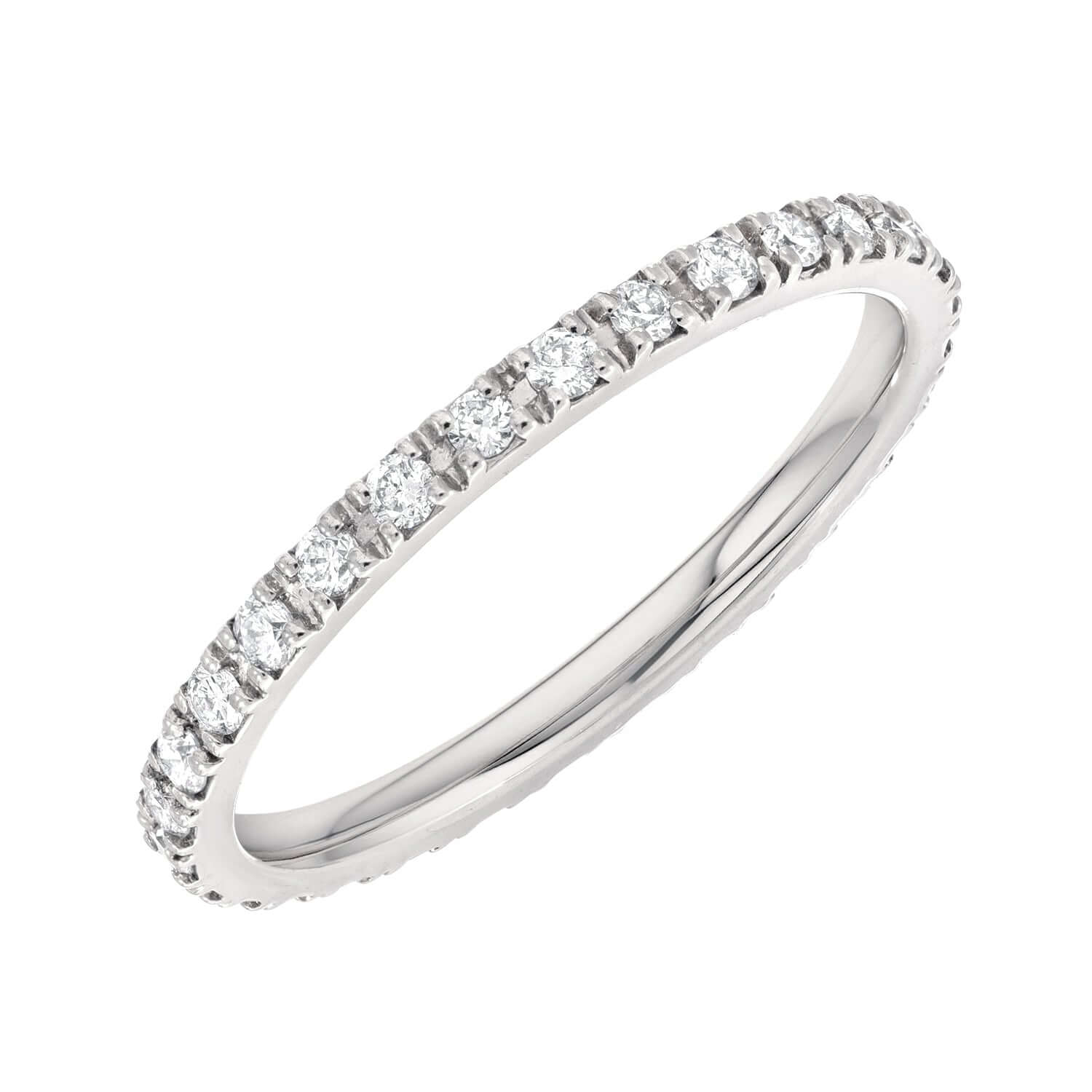 The Diamond Ellory Ring, a thin silver band epitomizing fine jewelry, features small round diamonds spaced evenly around its circumference and beautifully showcased against a plain white background.