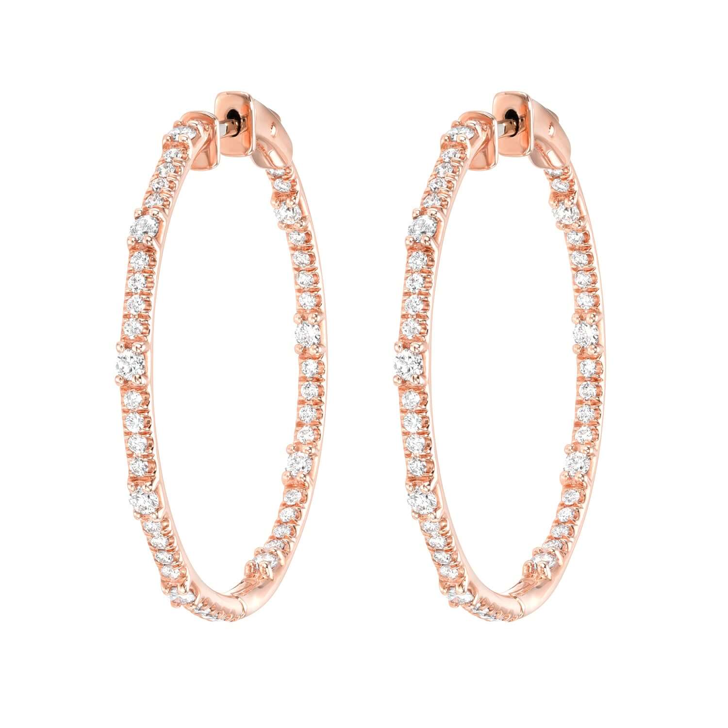 The Round Chandler Hoops from Janet Heller Fine Jewelry crafted in 14KT gold are adorned with small sparkling white diamonds. The diamonds in the earrings are a total of 1.76 carats.