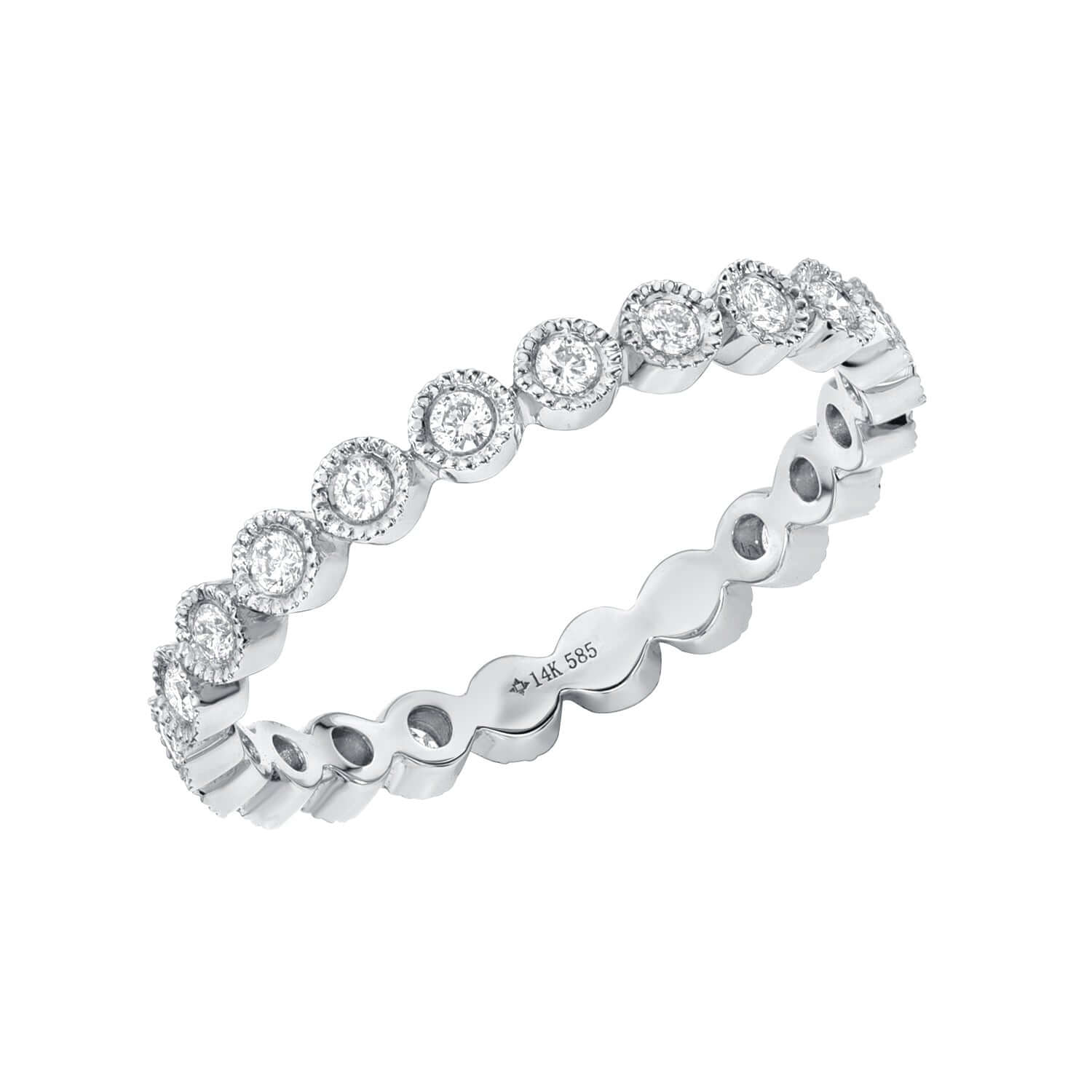 The Capri Ring is a silver eternity band showcasing fine jewelry elegance, adorned with small round diamonds in beaded circular frames. It features a 14K hallmark engraving and is available for preorder.