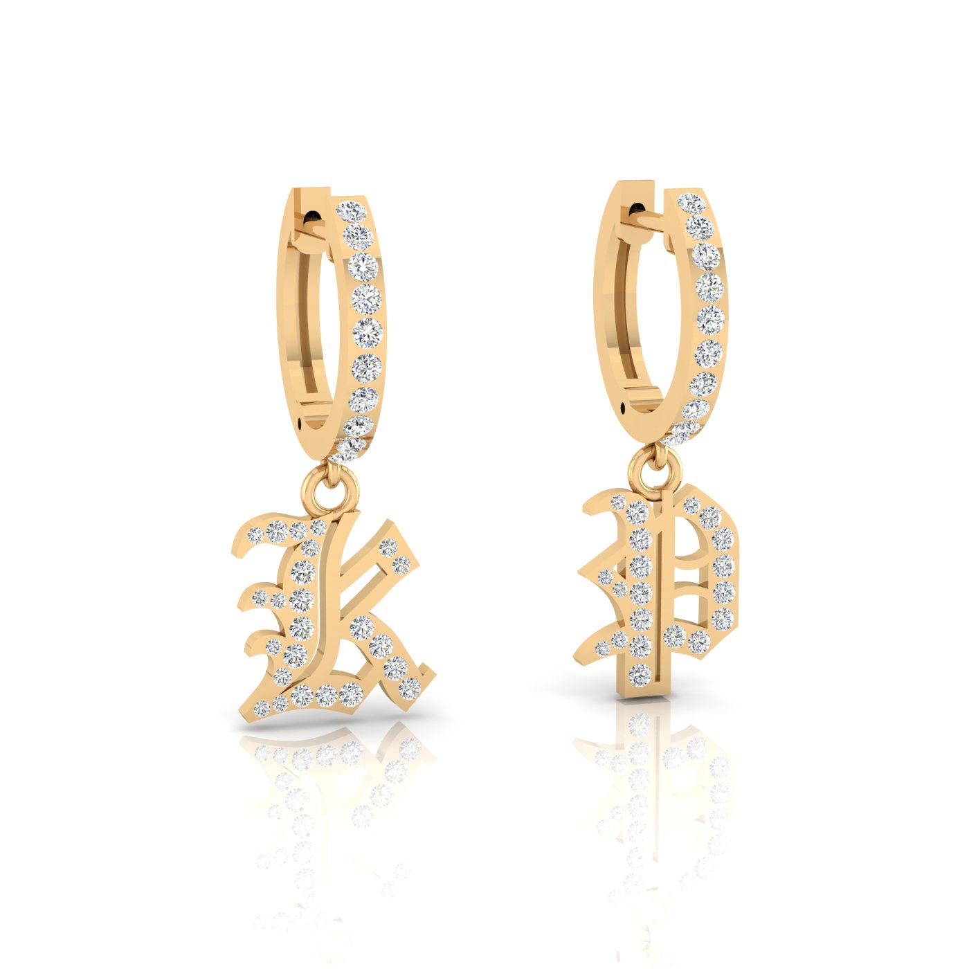 The Small Old English Initial Huggies are gold hoop earrings featuring diamond-studded hanging charms with ornate letters. Their shiny surface and reflective finish create a unique contrast against the white background.