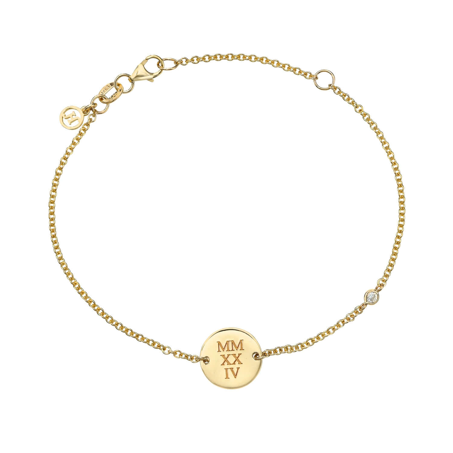 The Mini Diamond Sketch Bracelet is a gold chain bracelet with a round disc engraved with MMXXIV, featuring a small charm by the clasp and subtle gemstone accents.