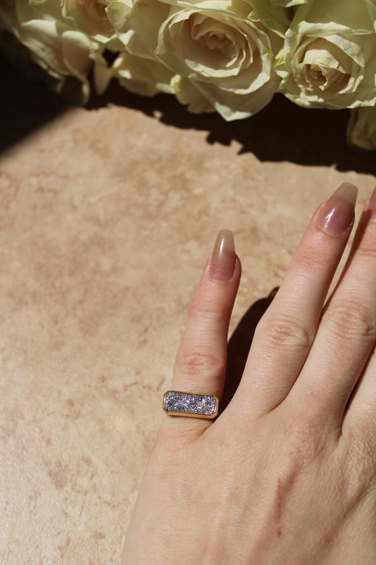 The Horizontal Diamond Rectangle Ring from Janet Heller Fine Jewelry is crafted in 14KT gold. The band features a rectangular design encrusted with diamonds. The ring can be stacked or worn on its own.