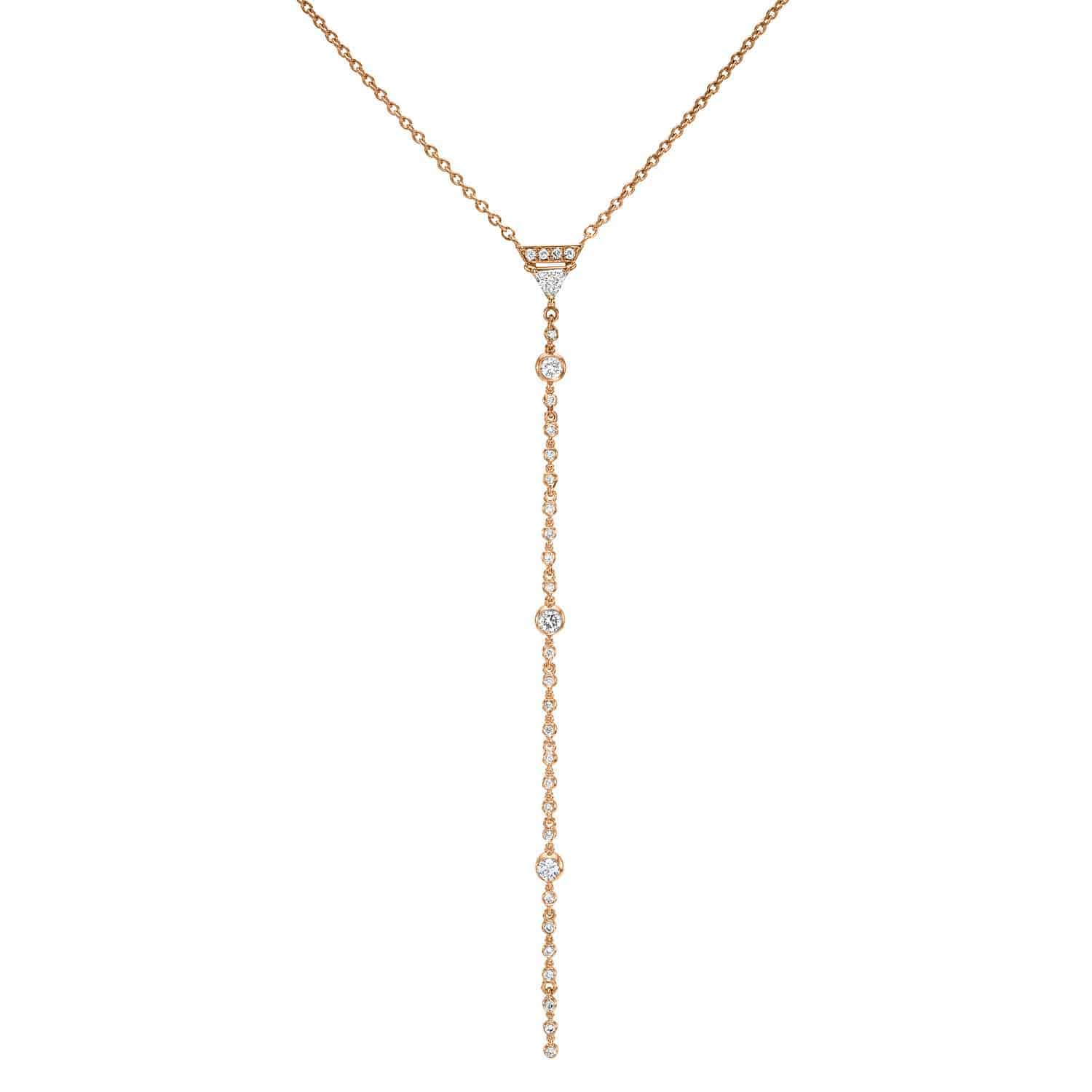 The Diamond Josie Lariat by JanetHellerFineJewelry is a gold necklace with a delicate chain and five diamond accents on a vertical drop. This elegant piece is perfect for formal occasions and can be customized to match your unique style.