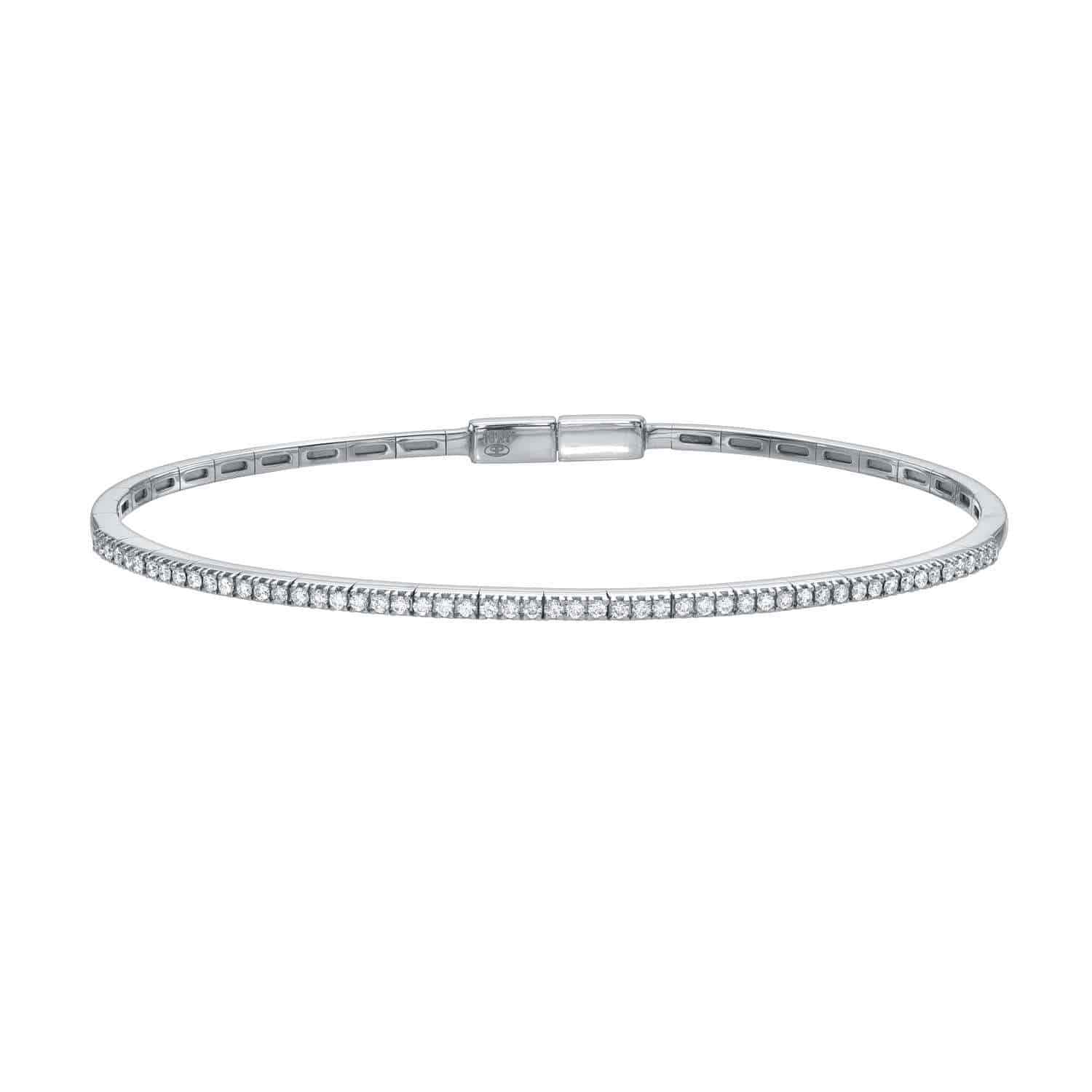 The Diamond London Bangle is a delicate silver tennis bracelet adorned with small, round diamonds in a continuous row. With a sleek, minimalist design and secure clasp, it offers subtle elegance for any occasion.