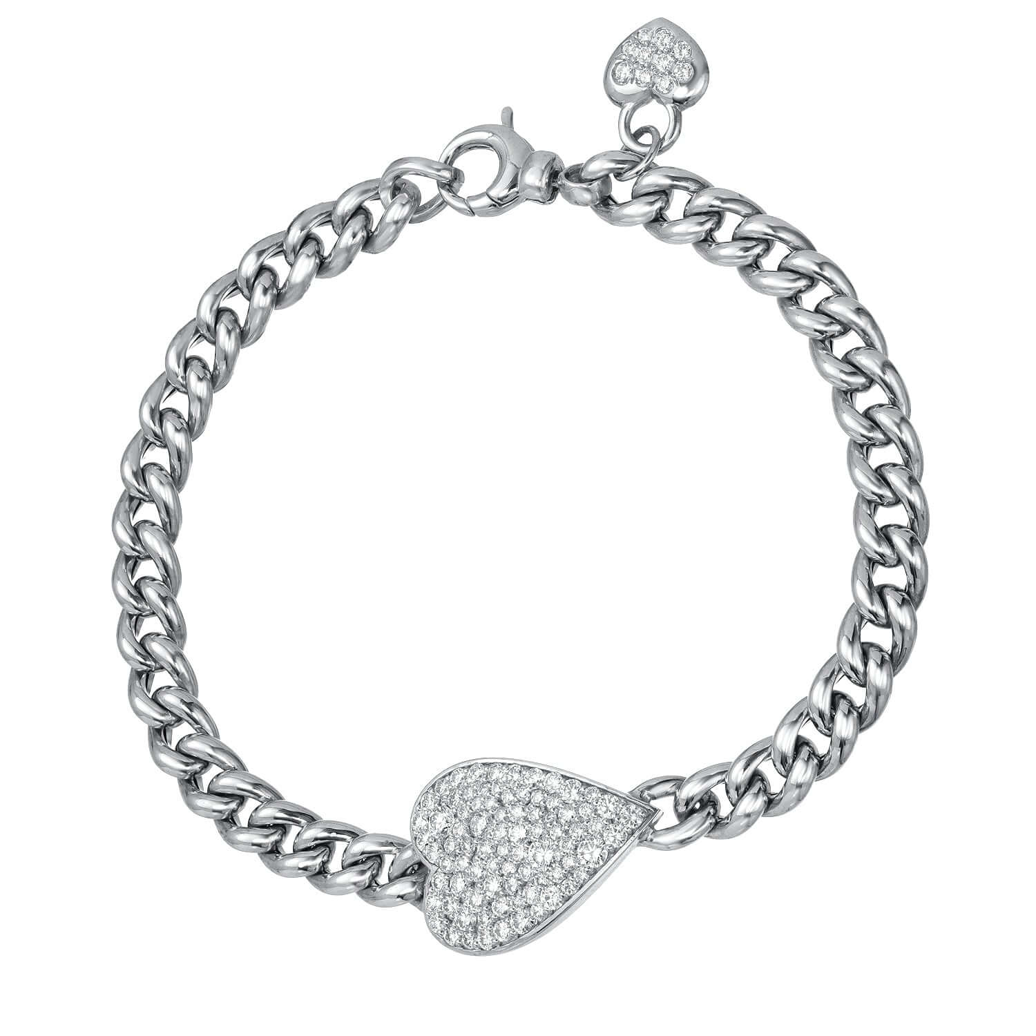 The Cuban Link Diamond Heart Bracelet from Janet Heller Fine Jewelry is crafted in 14KT gold. The chain features a diamond-encrusted heart-shaped pendant and a smaller diamond heart dangles near the clasp. The diamonds are G-H in color and the clarity is VS.