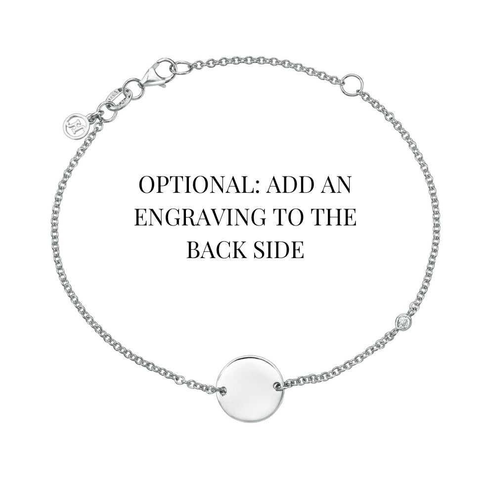 The Mini Diamond Sketch Bracelet is a delicate silver piece featuring a central circular pendant, an optional back engraving, and a small brand charm near the clasp.