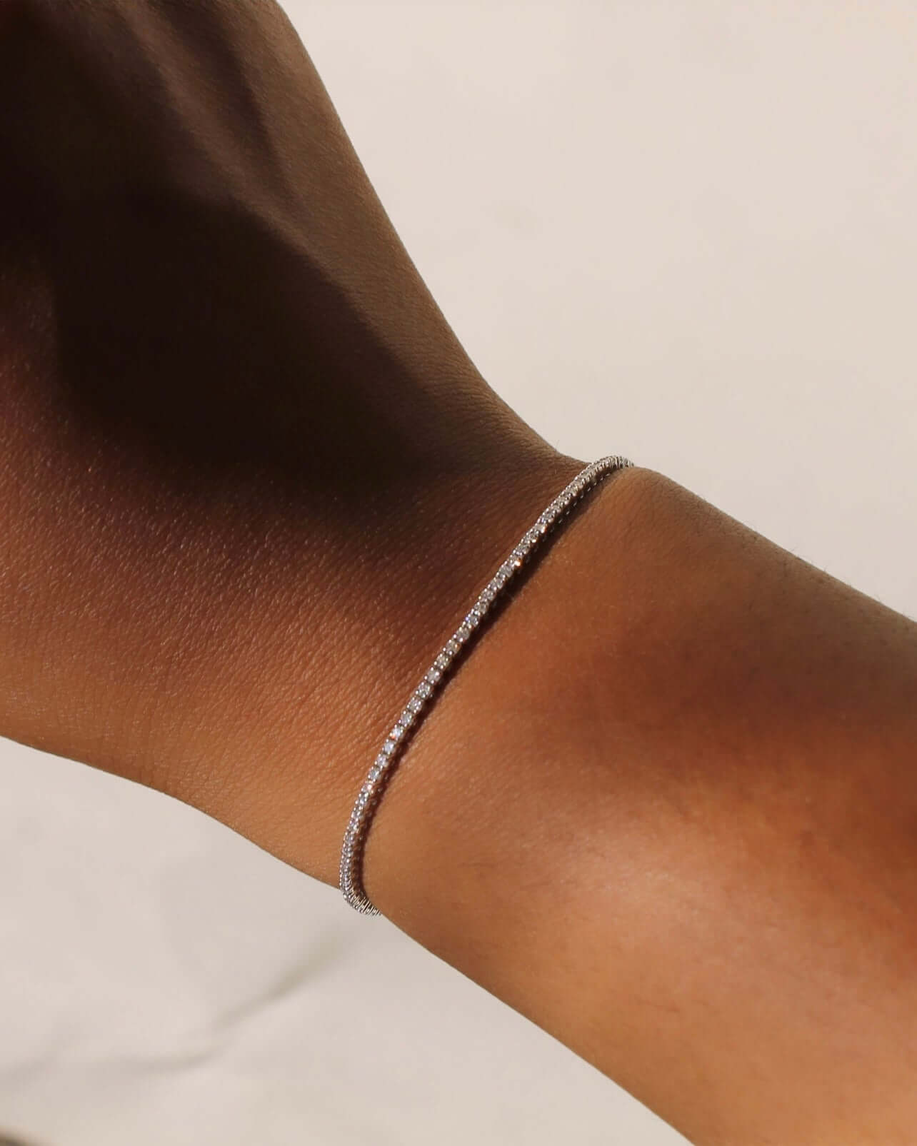 The 1ct Round Diamond Tennis Bracelet from Janet Heller Fine Jewelry is crafted in 14KT gold. The bracelet features  small diamonds in a continuous line and is available in both lab grown and natural diamonds.  The bracelet can be worn on its worn or layered with other bracelets.