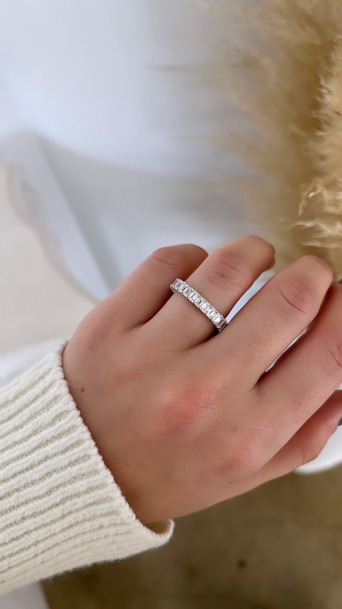 The Full Diamond Eternity Ring from Janet Heller Fine Jewelry, crafted in 18KT gold, features evenly spaced diamonds offered in various shapes and custom carat weights. The color of the diamonds is F and the clarity is VS. This is the perfect wedding band to be worn alone or stacked with your engagement ring.