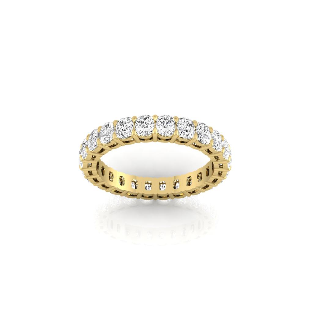 The Full Lab Grown Diamond Eternity Ring from Janet Heller Fine Jewelry, crafted in 18KT gold, features evenly spaced diamonds offered in various shapes and custom carat weights. The color of the diamonds is F and the clarity is VS. This is the perfect wedding band to be worn alone or stacked with your engagement ring.
