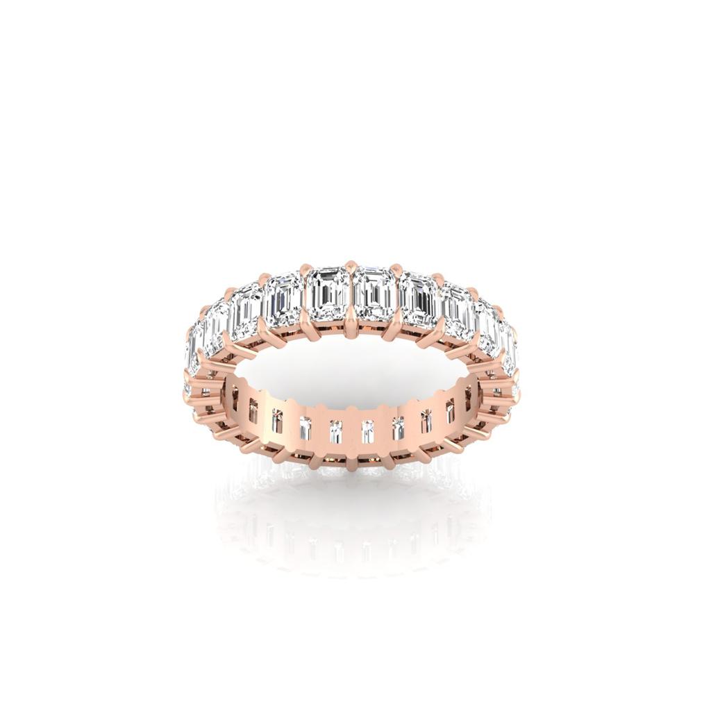The Full Lab Grown Diamond Eternity Ring from Janet Heller Fine Jewelry, crafted in 18KT gold, features evenly spaced diamonds offered in various shapes and custom carat weights. The color of the diamonds is F and the clarity is VS. This is the perfect wedding band to be worn alone or stacked with your engagement ring.