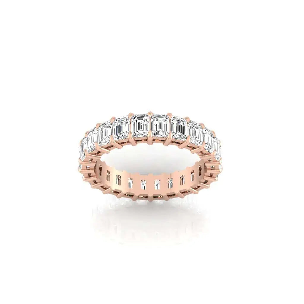 The Full Diamond Eternity Ring from Janet Heller Fine Jewelry, crafted in 18KT gold, features evenly spaced diamonds offered in various shapes and custom carat weights. The color of the diamonds is F and the clarity is VS. This is the perfect wedding band to be worn alone or stacked with your engagement ring.