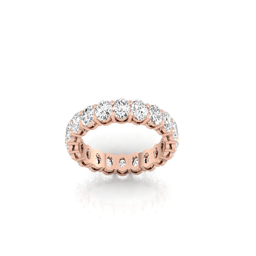 The Full Lab Grown Diamond Eternity Ring from Janet Heller Fine Jewelry, crafted in 18KT gold, features evenly spaced diamonds offered in various shapes and custom carat weights. The color of the diamonds is F and the clarity is VS. This is the perfect wedding band to be worn alone or stacked with your engagement ring.