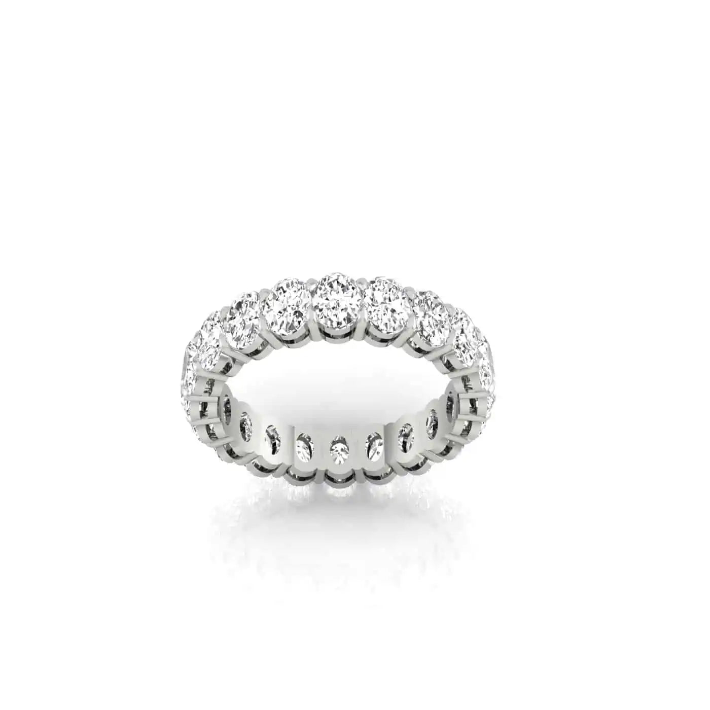 The Full Diamond Eternity Ring from Janet Heller Fine Jewelry, crafted in 18KT gold, features evenly spaced diamonds offered in various shapes and custom carat weights. The color of the diamonds is F and the clarity is VS. This is the perfect wedding band to be worn alone or stacked with your engagement ring.