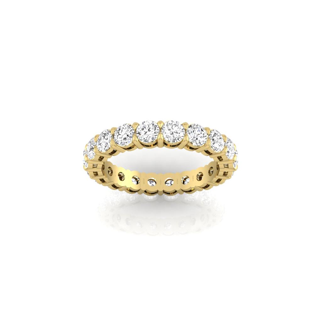 A stunning Full Lab Grown Diamond Eternity Ring crafted in 18KT gold, featuring a seamless circle of round, dazzling diamonds with F color and VS clarity, set against a clean white backdrop.