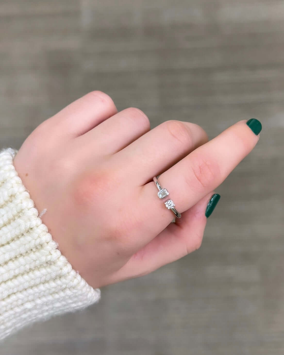 The Emerald & Round Toi Et Moi Ring, from Janet Heller Fine Jewelry, crafted in 14KT gold features an emerald and round-shaped diamond charm. The emerald is in a bezel setting and round stone is set in a prong setting. The ring looks beautiful on its own or can be stacked with other rings.