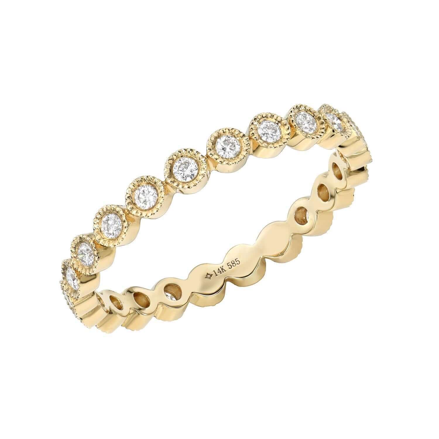 The Capri Ring is a fine jewelry gold eternity band by Janet Heller, showcasing round diamonds in circular bezels with textured edges and an inner band engraved with 14K 585. This exclusive preorder piece blends timeless elegance and artisan detail.