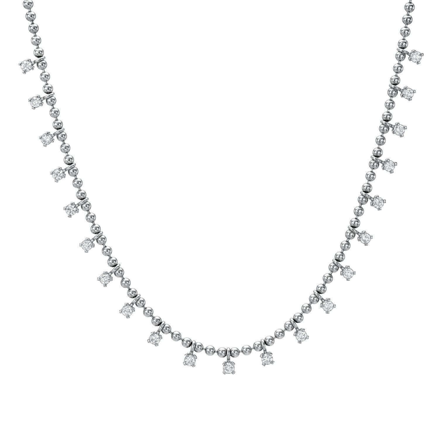 The Janet Heller Fine Jewelry collections Diamond Kylie Necklace features a silver chain embellished with small, evenly spaced round diamond-like stones in a delicate pattern of alternating singles and pairs, offering a sparkling, elegant look that epitomizes timeless sophistication.
