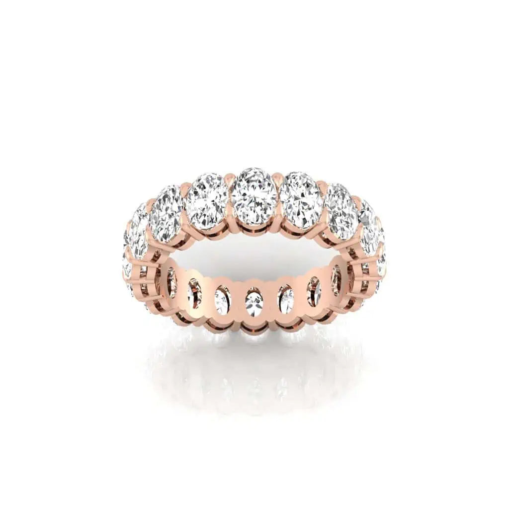 The Full Diamond Eternity Ring from Janet Heller Fine Jewelry, crafted in 18KT gold, features evenly spaced diamonds offered in various shapes and custom carat weights. The color of the diamonds is F and the clarity is VS. This is the perfect wedding band to be worn alone or stacked with your engagement ring.