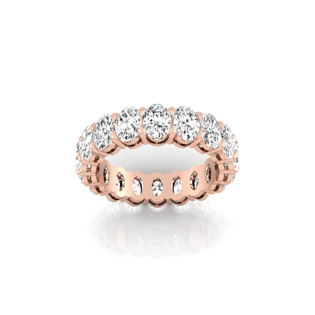 The Full Lab Grown Diamond Eternity Ring from Janet Heller Fine Jewelry, crafted in 18KT gold, features evenly spaced diamonds offered in various shapes and custom carat weights. The color of the diamonds is F and the clarity is VS. This is the perfect wedding band to be worn alone or stacked with your engagement ring.