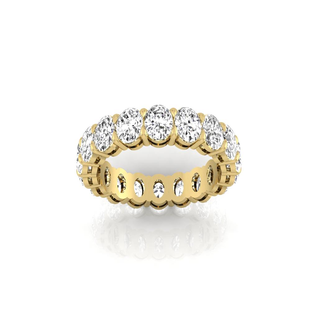 The Full Lab Grown Diamond Eternity Ring from Janet Heller Fine Jewelry, crafted in 18KT gold, features evenly spaced diamonds offered in various shapes and custom carat weights. The color of the diamonds is F and the clarity is VS. This is the perfect wedding band to be worn alone or stacked with your engagement ring.