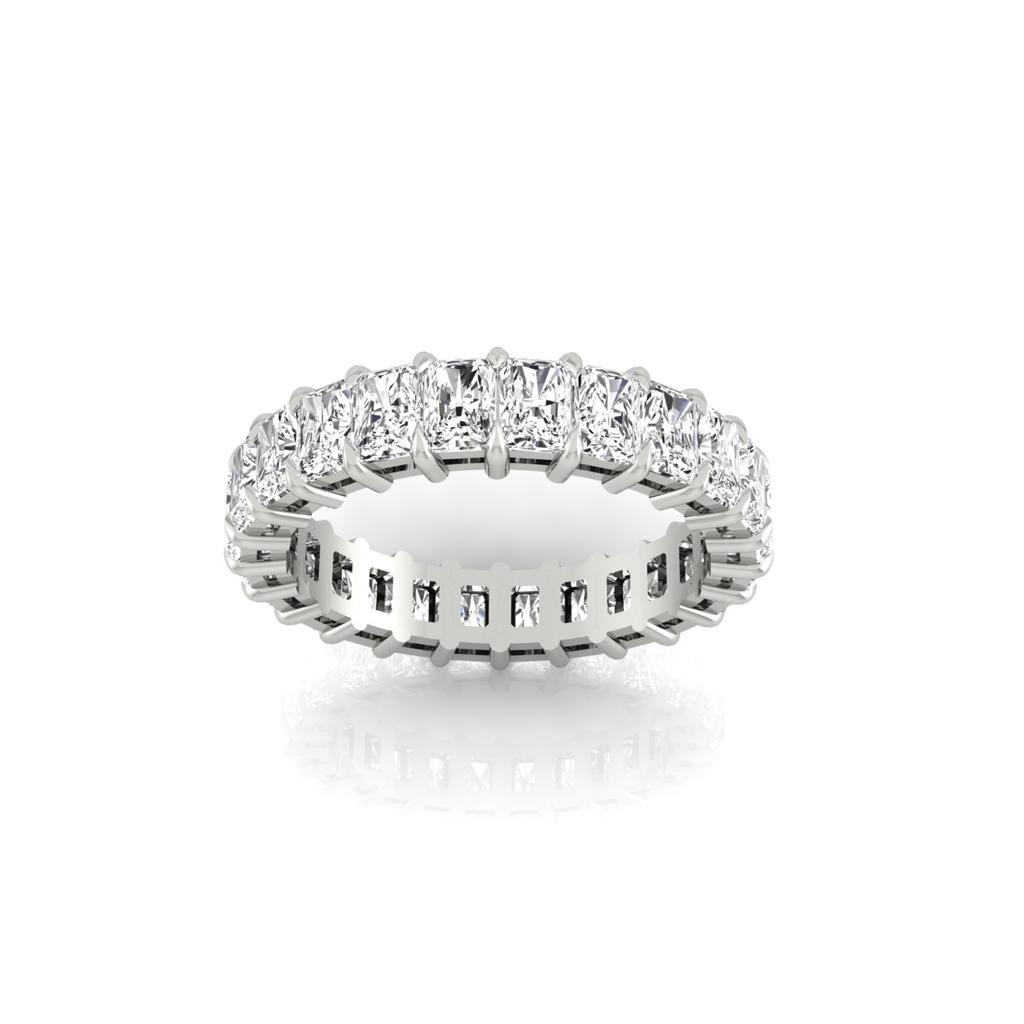 The Full Lab Grown Diamond Eternity Ring features a silver design in 18KT gold, with F Color VS Clarity rectangular-cut diamonds elegantly arranged around the band for a luxurious look, shown against a white background.
