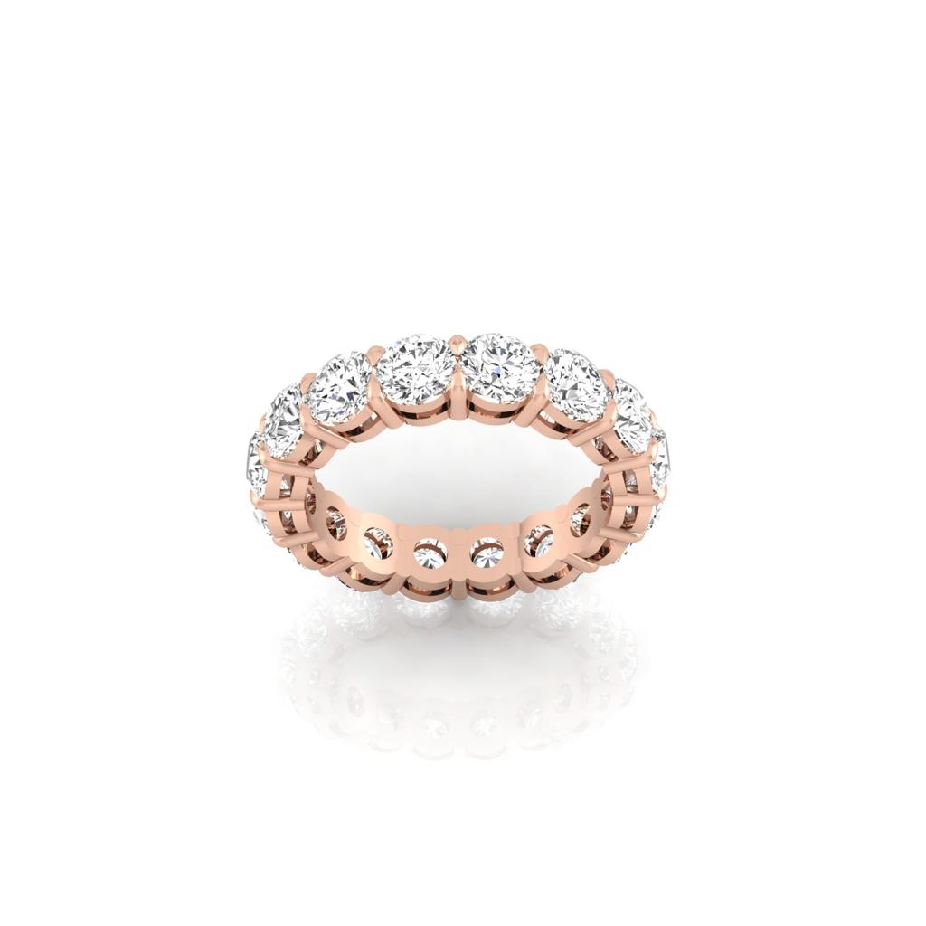 The Full Lab Grown Diamond Eternity Ring, crafted in 18KT gold, features a stunning seamless line of round-cut diamonds encircling the band, beautifully highlighted against a pristine white background.