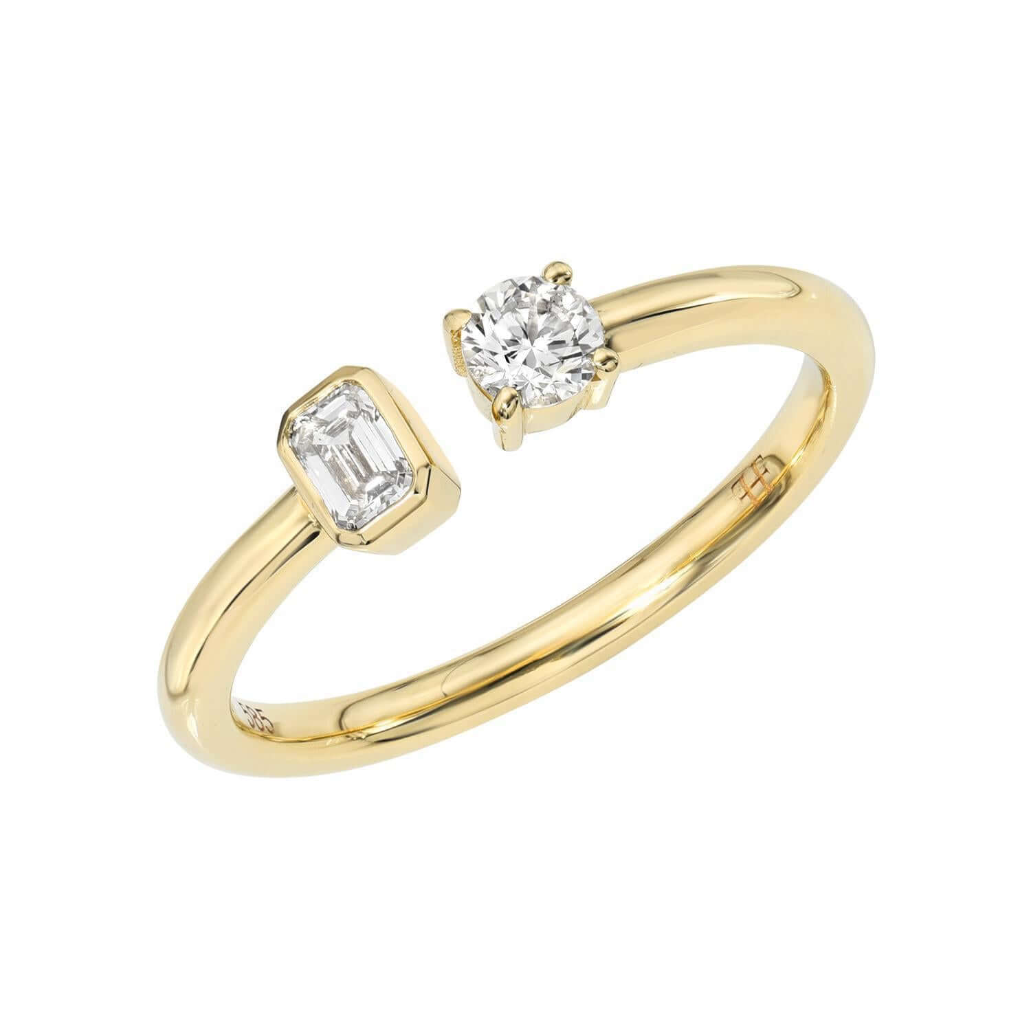 The Emerald & Round Toi Et Moi Ring from Janet Heller Fine Jewelry, is crafted in 14KT gold and features emerald and round-cut diamonds. The emerald diamond is 0.15 carats in a bezel setting and the 0.15 carat round diamond is in a prong setting. The ring can be stacked or worn on its own.