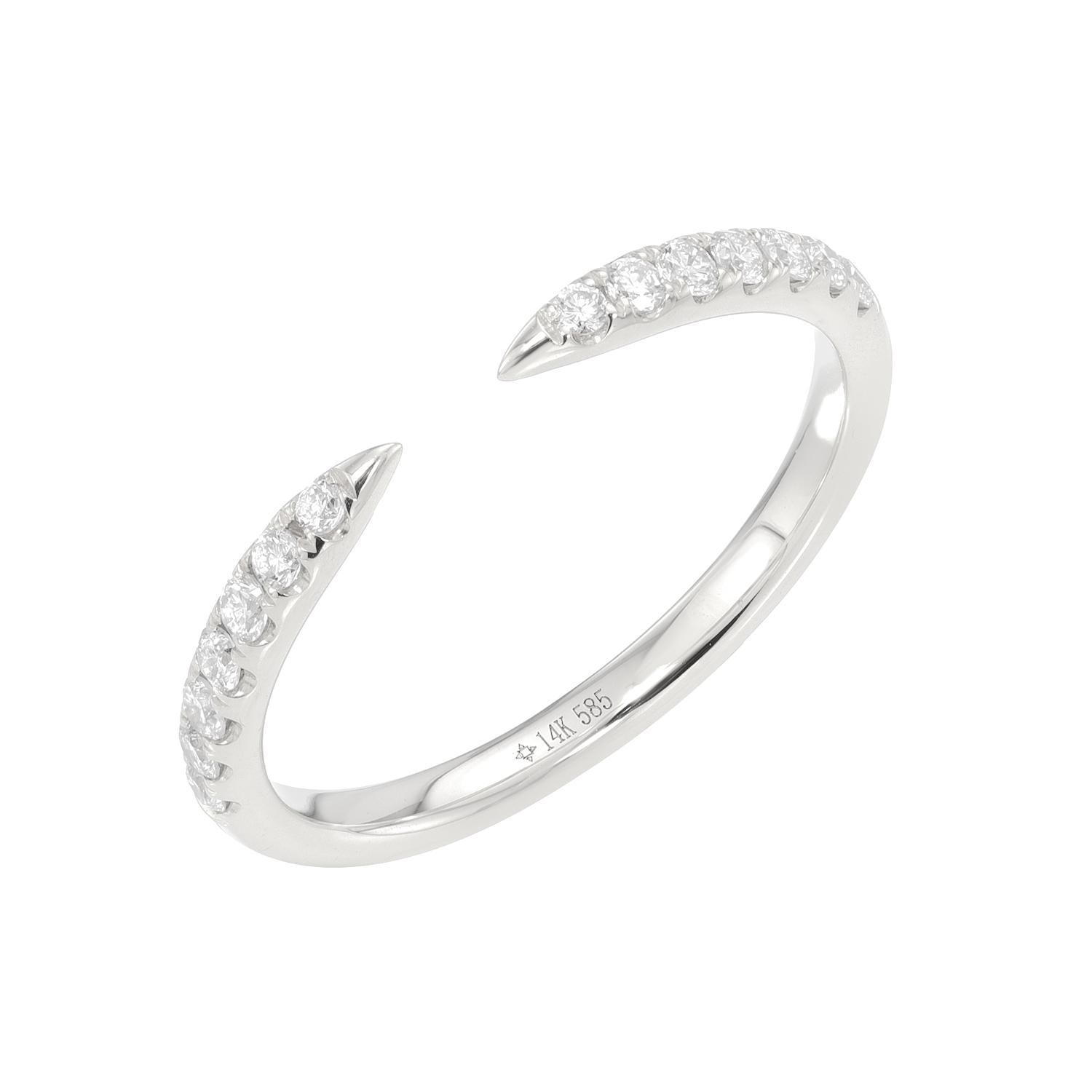 The Open Diamond Cuff Ring features a sleek, open-ended silver design with small sparkling diamonds at each tapered end. Inside, 14k 585 is inscribed to denote purity. This elegant, modern ring beautifully reflects light and is available for preorder now.