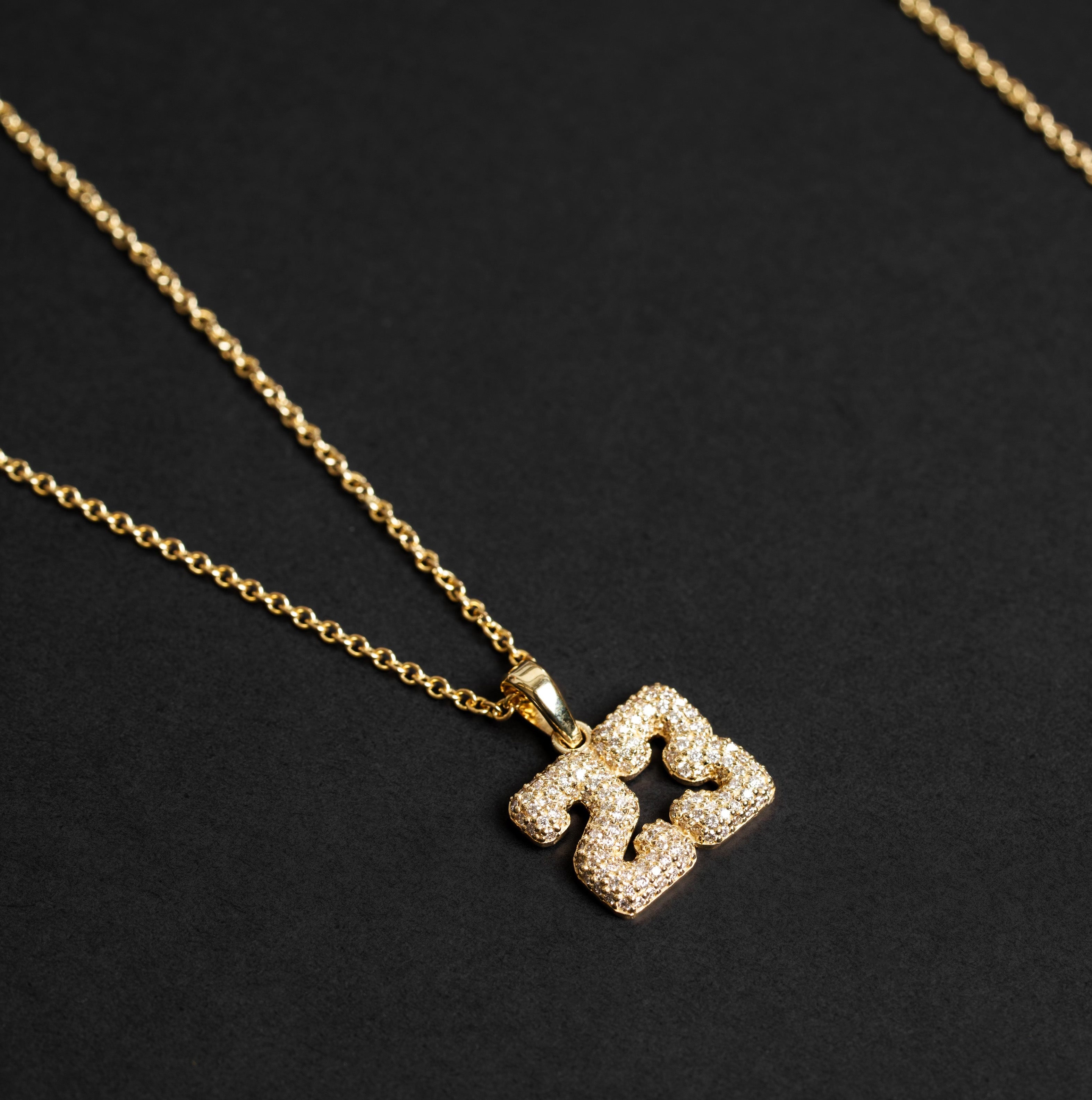 The Varsity Diamond Number Necklace from Janet Heller Fine Jewelry is crafted in 14KT gold. The necklace features a diamond number pendant. The charm is designed to celebrate a number that has special meaning. The necklace can be worn alone or layered with other chains and necklaces.