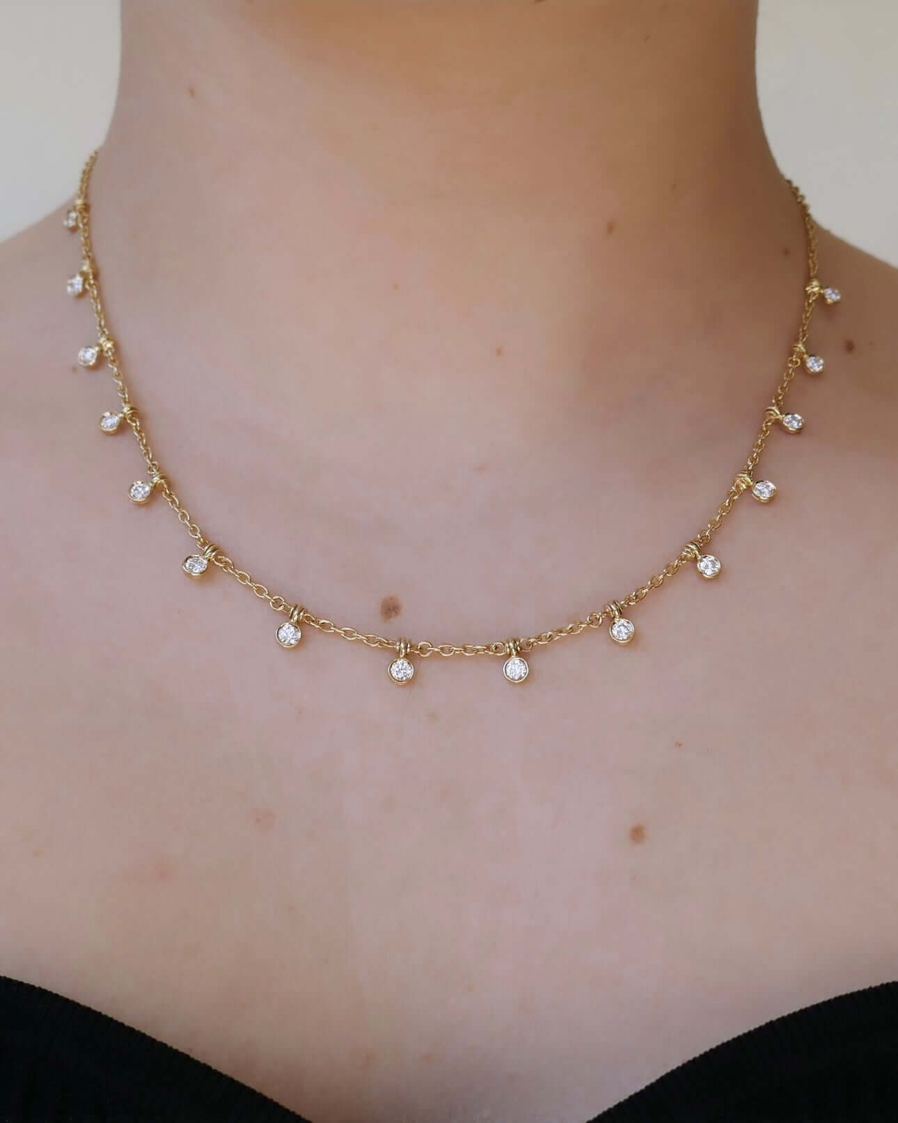 The Diamond Lyla Necklace from Janet Heller Fine Jewelry, is crafted in 14KT gold and features small round diamond pendants.  The necklace can be worn on its own or layered with other chains.