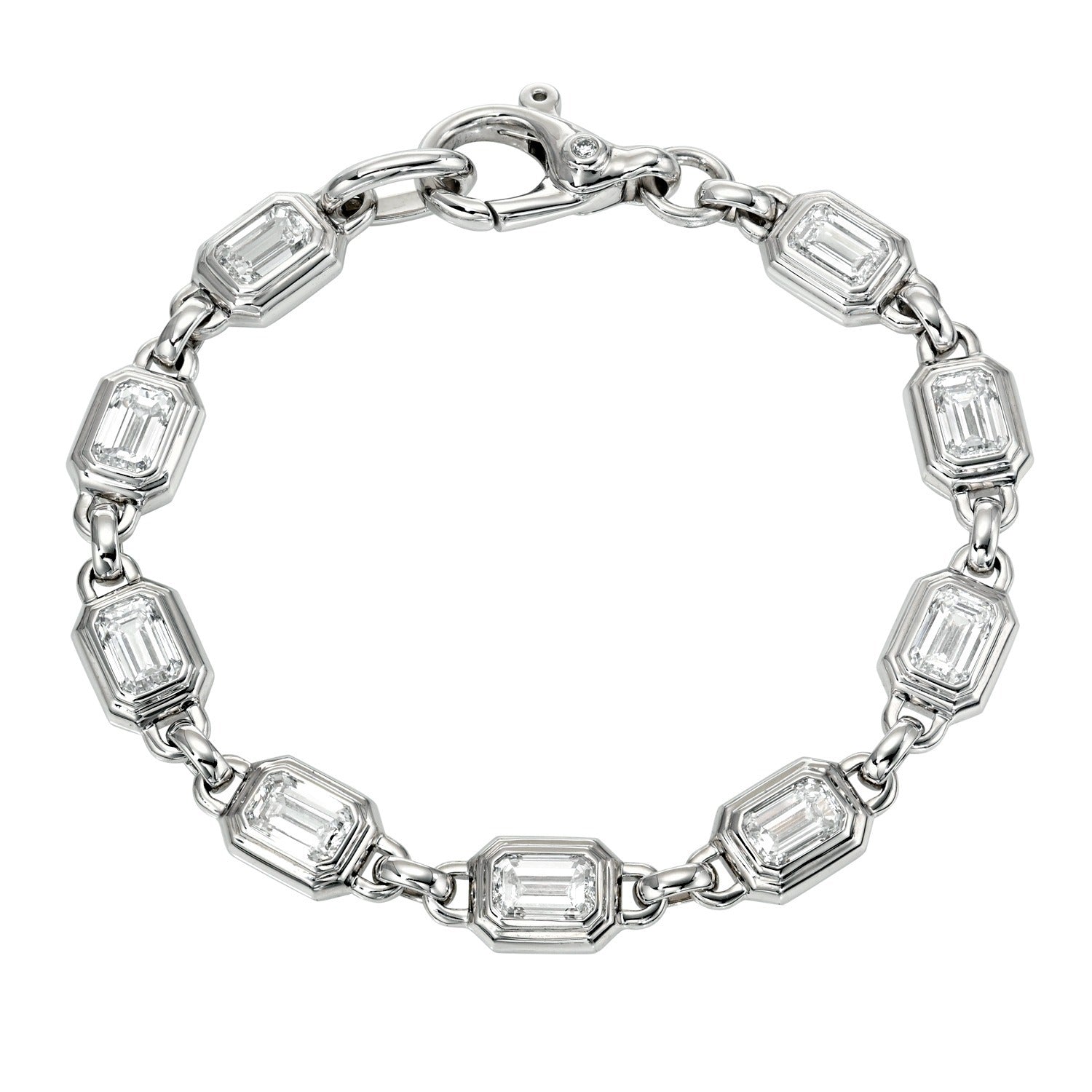 Introducing the Bezel Set Lab Emerald Tennis Bracelet, a sophisticated silver bracelet showcasing eight emerald-cut lab-grown emerald links, each elegantly framed in a geometric bezel and connected by small metal rings, finished with a secure lobster clasp closure.