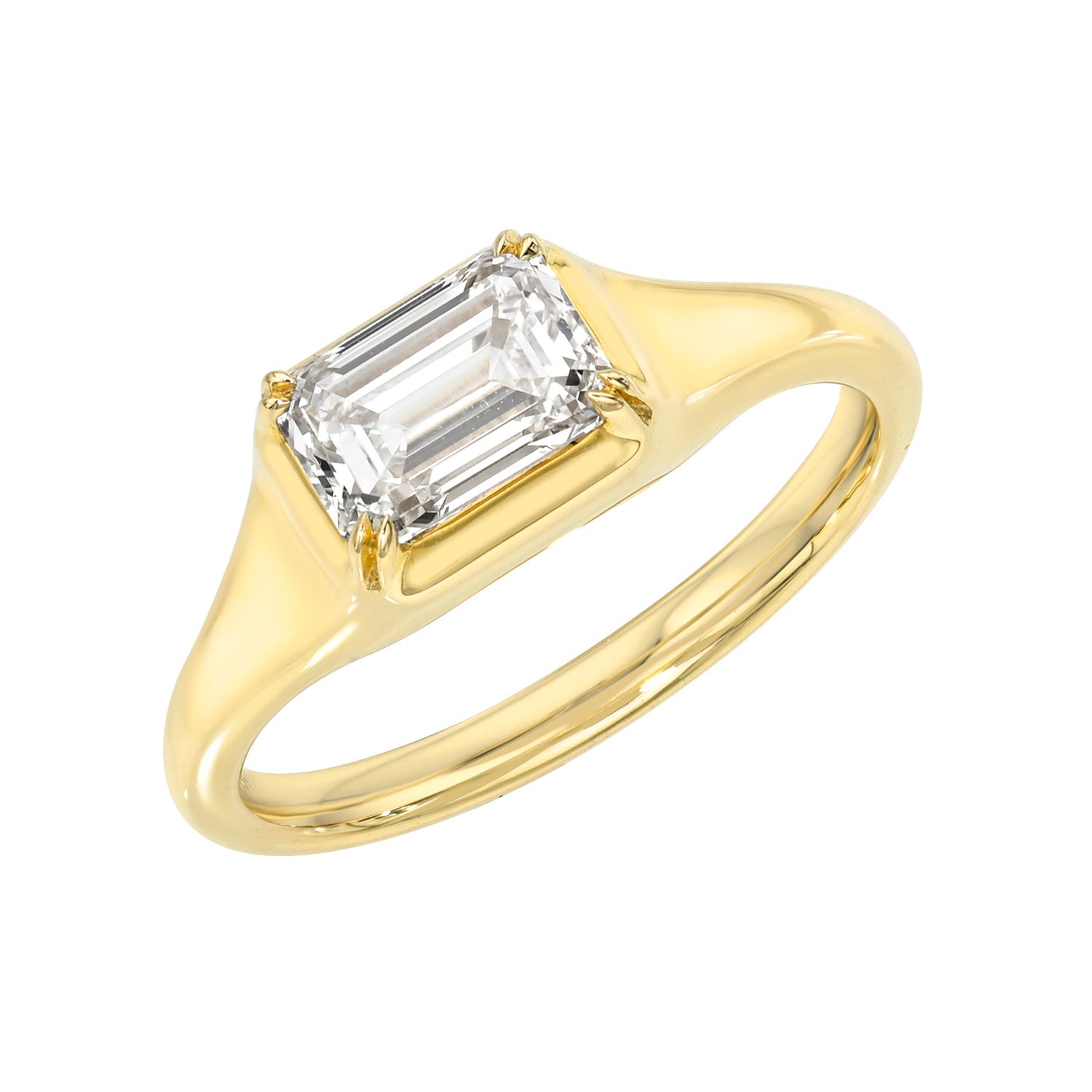 The Emerald Lab Diamond Pinky Ring showcases a rectangular emerald-cut lab diamond in a four-prong setting, highlighted against a white background.