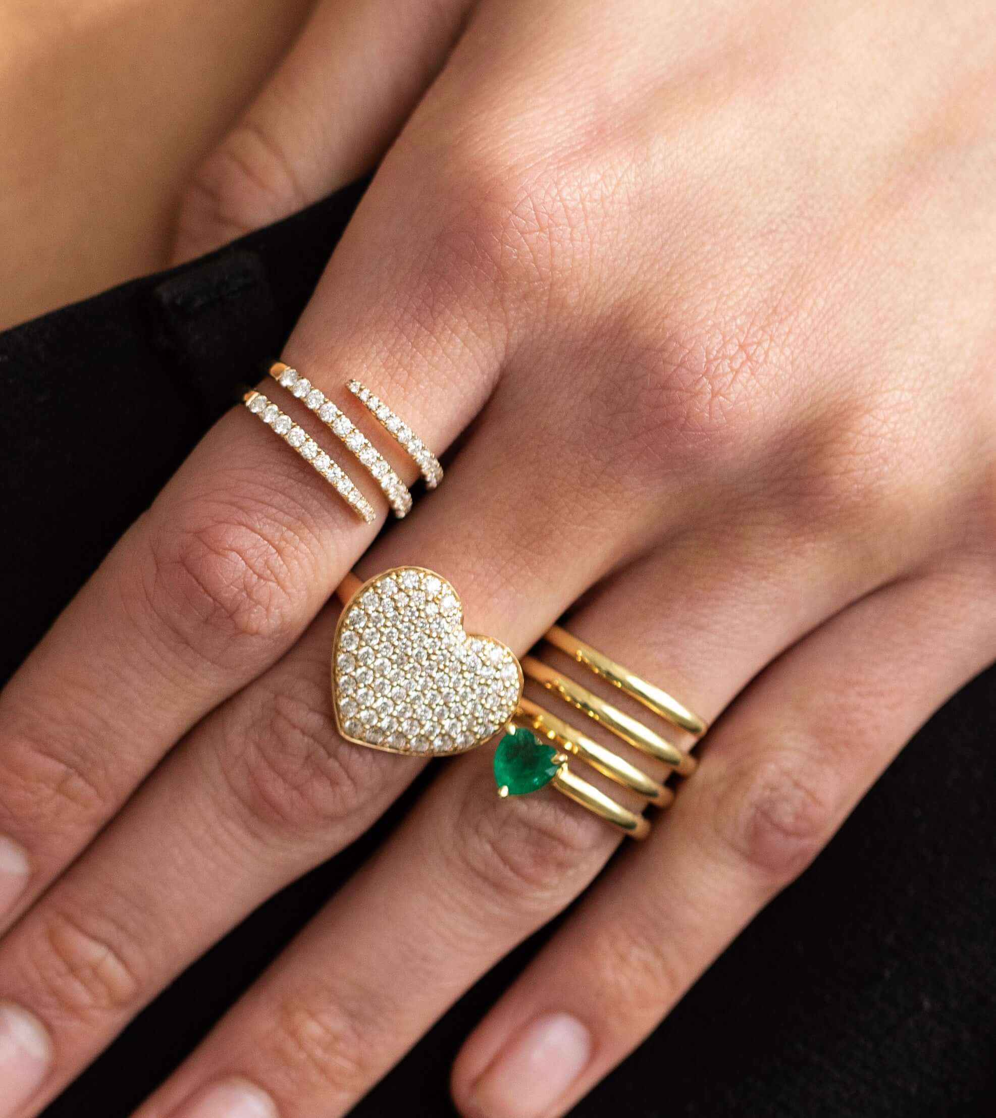 The Jumbo Diamond Heart Ring from Janet Heller Fine Jewelry is crafted in 14KT gold. The band features a large, gold encrusted heart. The ring can be worn alone or along side other rings.